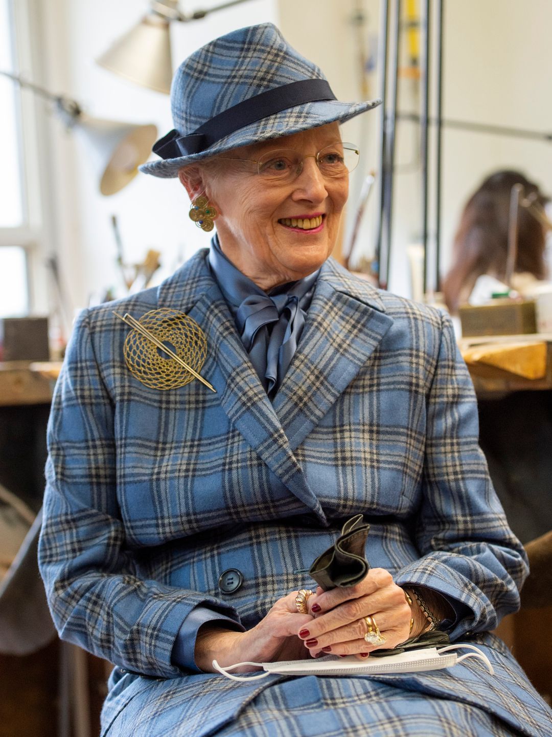 Queen Margrethe II of Denmark wears a matching blue plaid suit to attend a jewellery workshop in Munich 