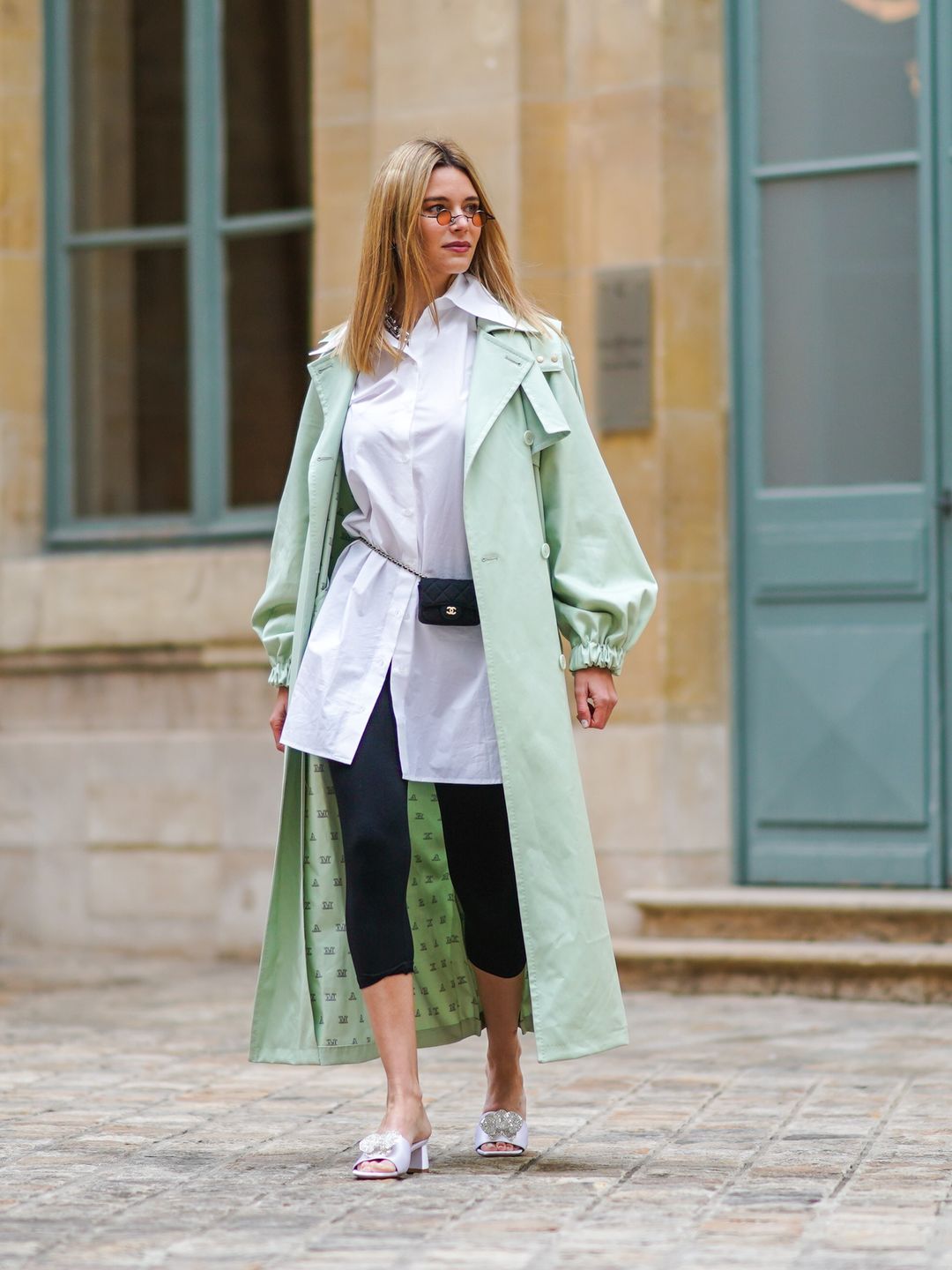 Natalia Verza styles capri leggings with a mint green coat 