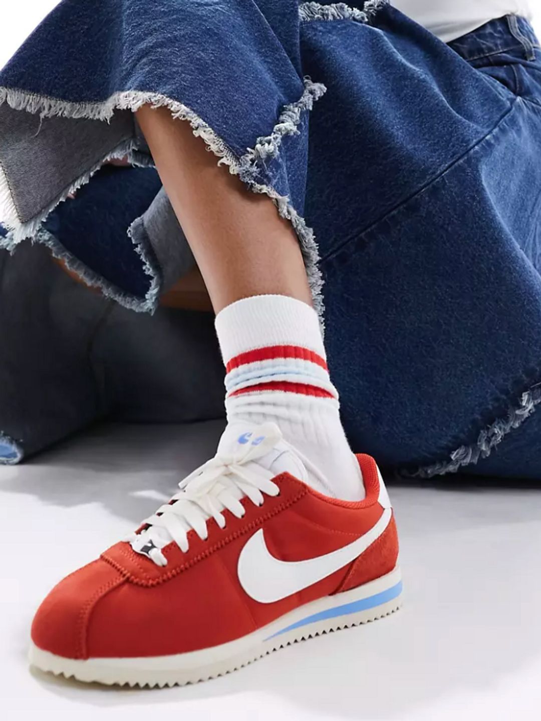 A close up of red Nike Cortez sneakers from ASOS
