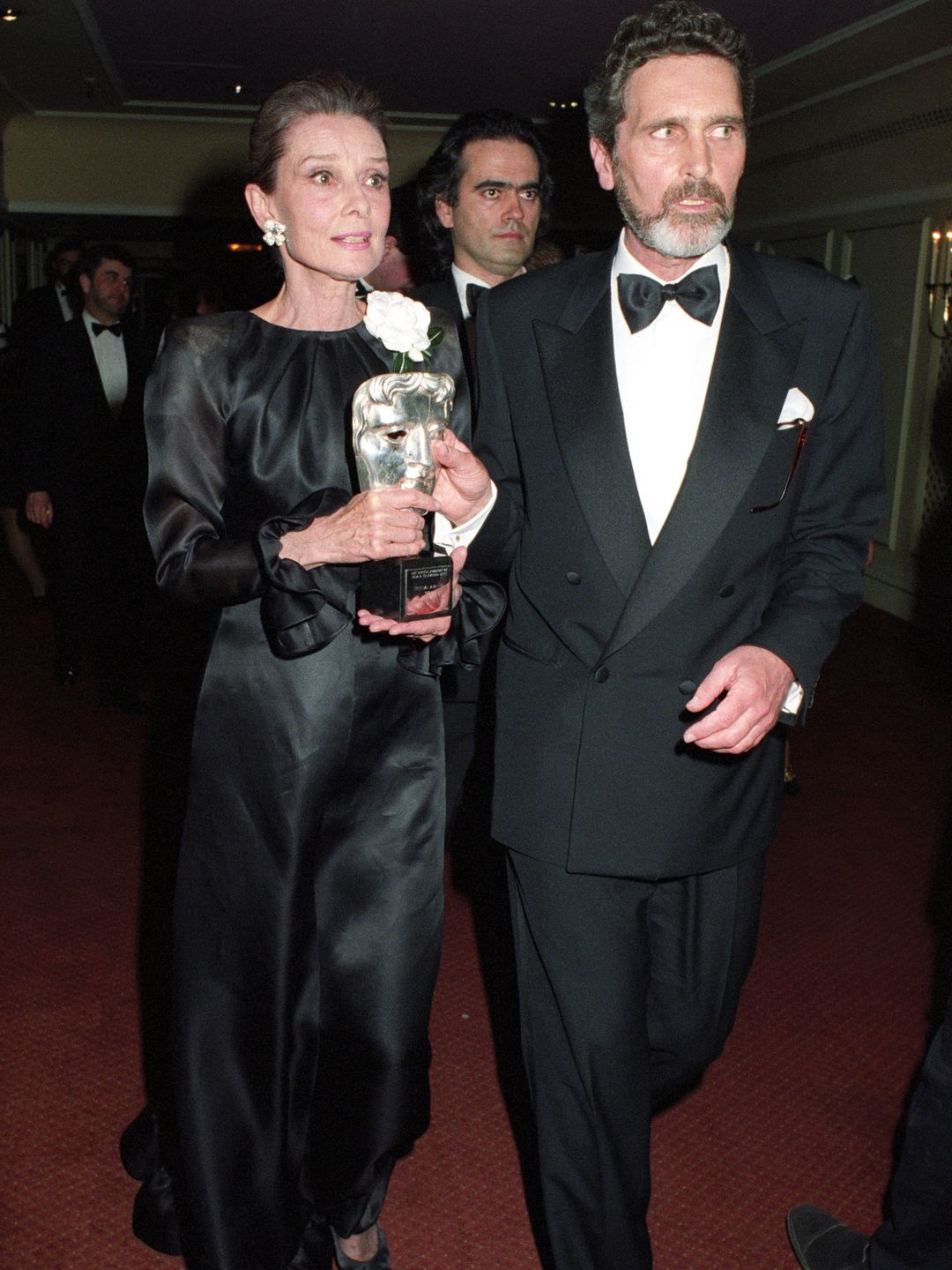 Audrey Hepburn and Robert Wolders during the BAFTA Awards on March 23, 1992 in London.