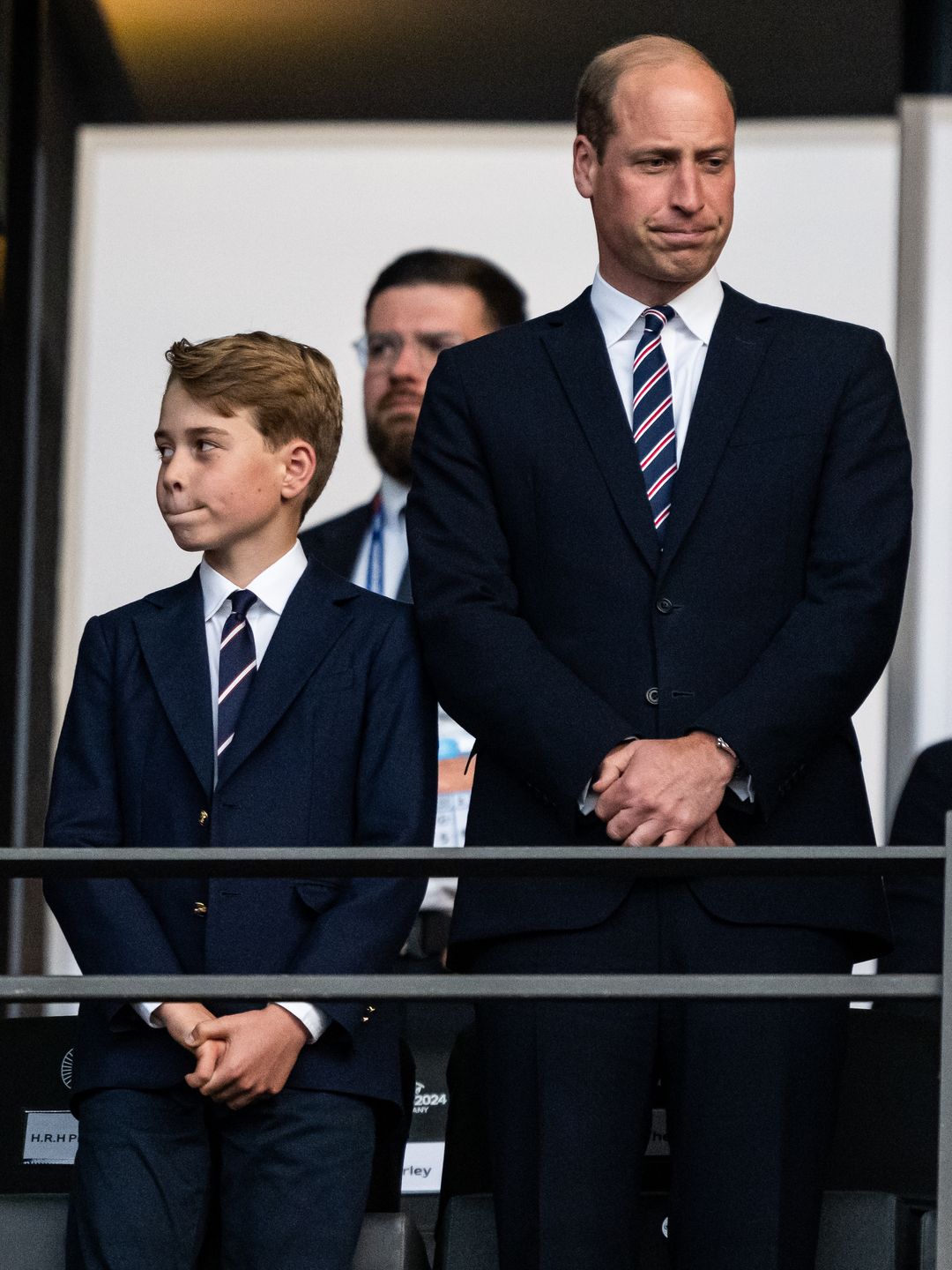 father and son at football match