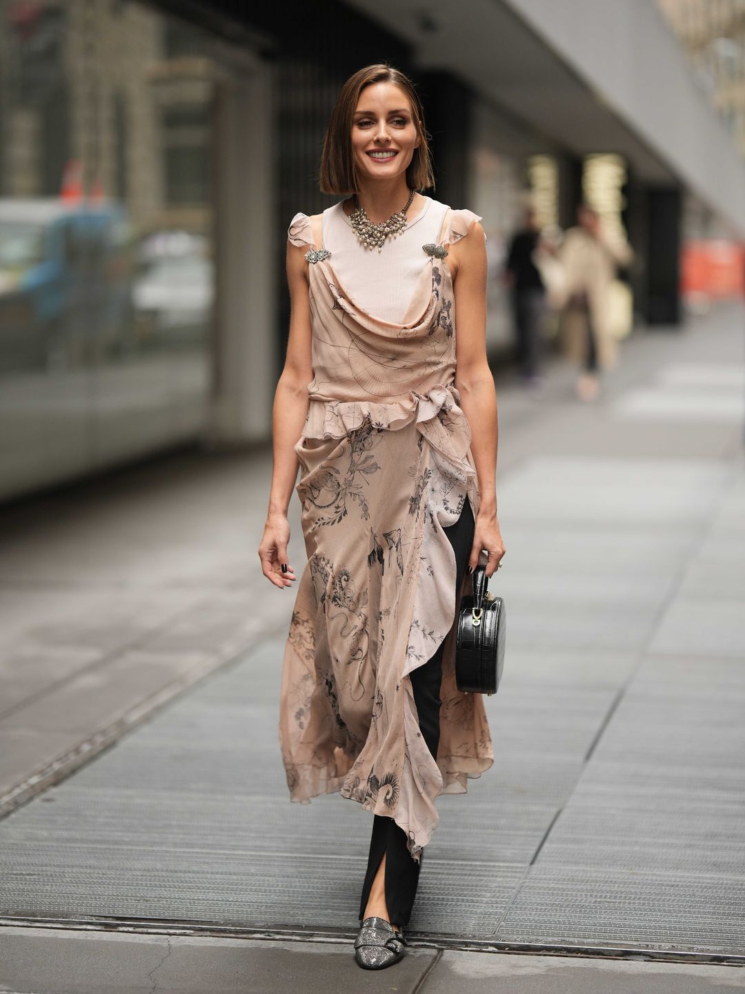 Olivia Palermo wears a flowy printed dress 