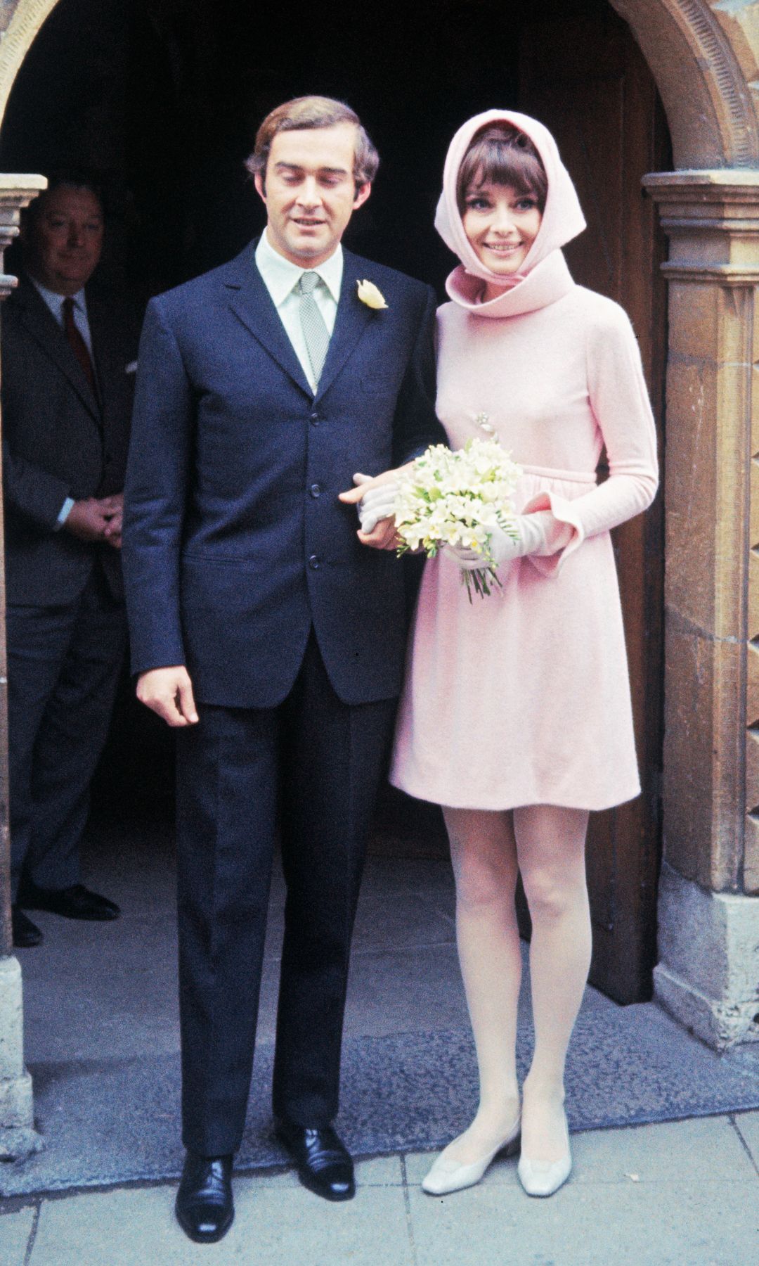 Film star Audrey Hepburn poses with her new husband, Italian psychiatrist Dr. Andrea Dotti, after their wedding, January 18th.