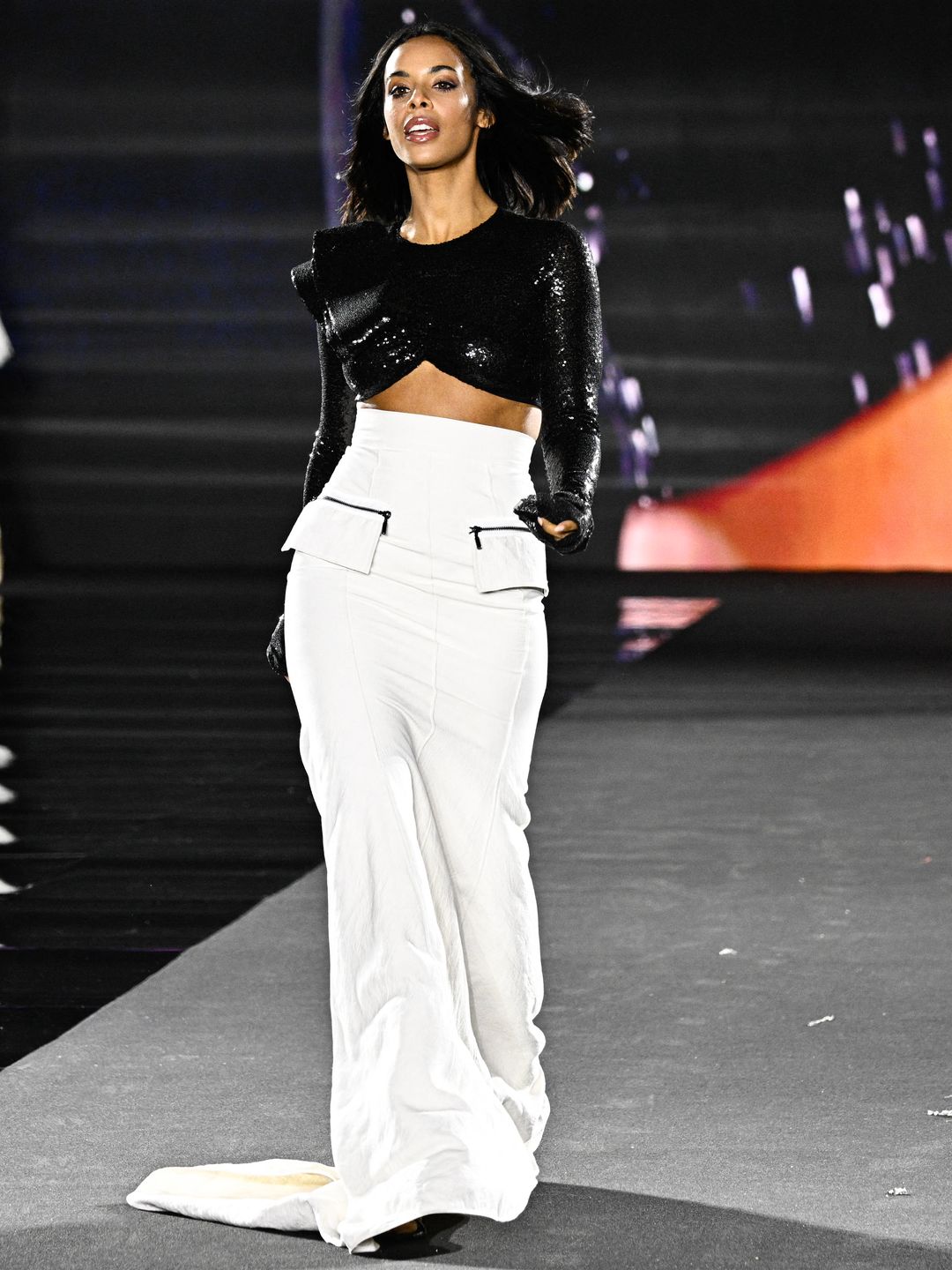 British singer and television host Rochelle Humes presents a creation for L'Oreal Paris show "Walk Your Worth" as part of the Paris Fashion Week Women Ready-to-wear Spring-Summer 2025 collection at Palais Garnier (Opera national de Paris) opera house, in Paris on September 23, 2024. (Photo by JULIEN DE ROSA / AFP) (Photo by JULIEN DE ROSA/AFP via Getty Images)