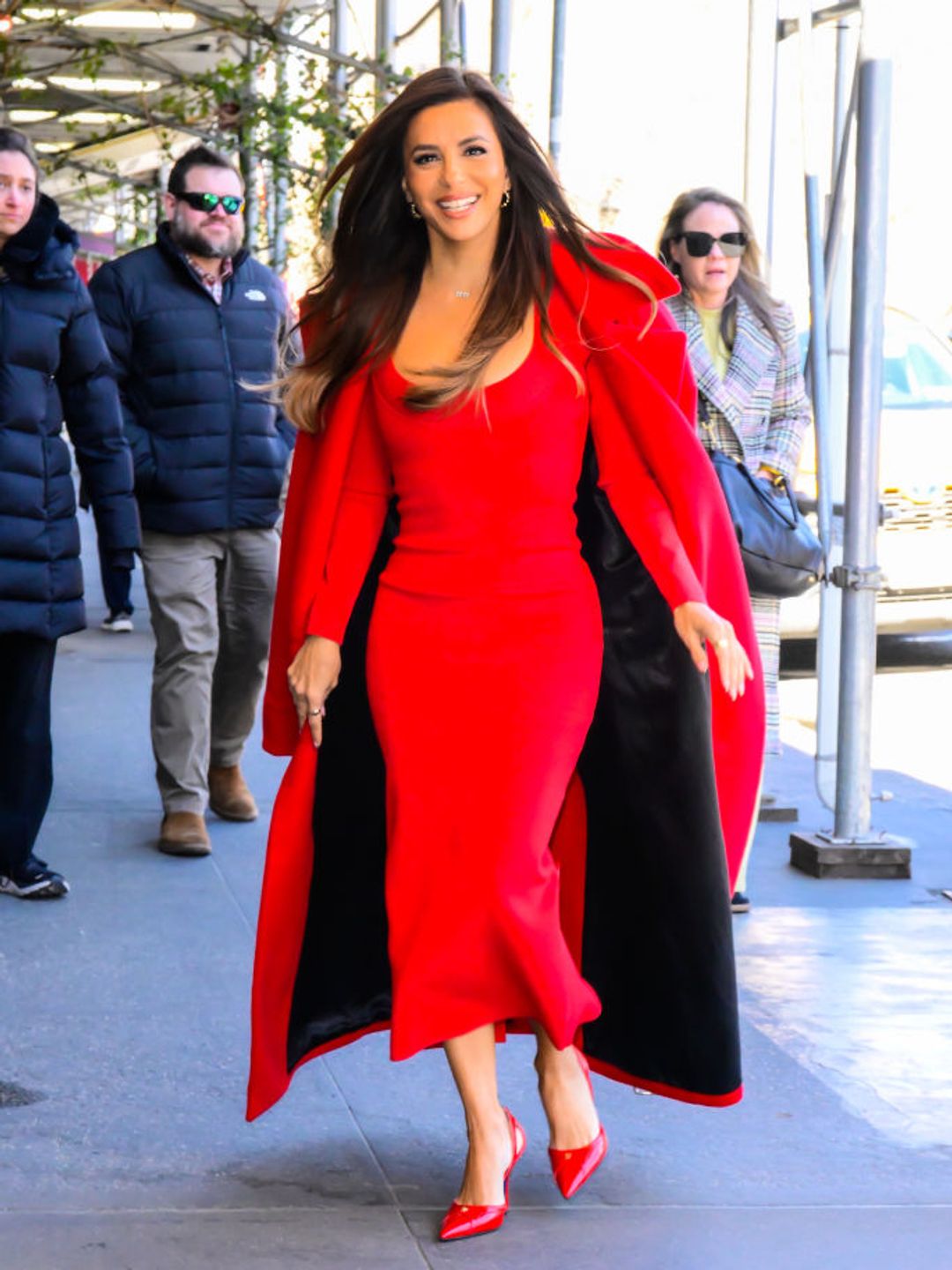 Eva Longoria's bold dress complemented her sleek hairstyle