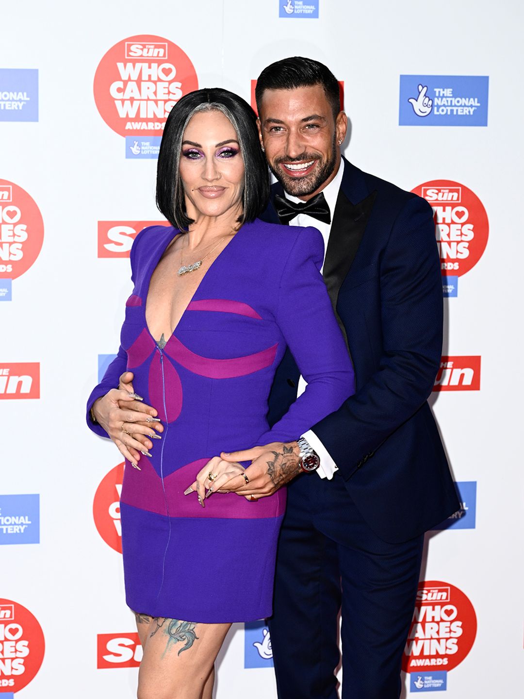 Michelle Visage and Giovanni Pernice cuddle up on the red carpet