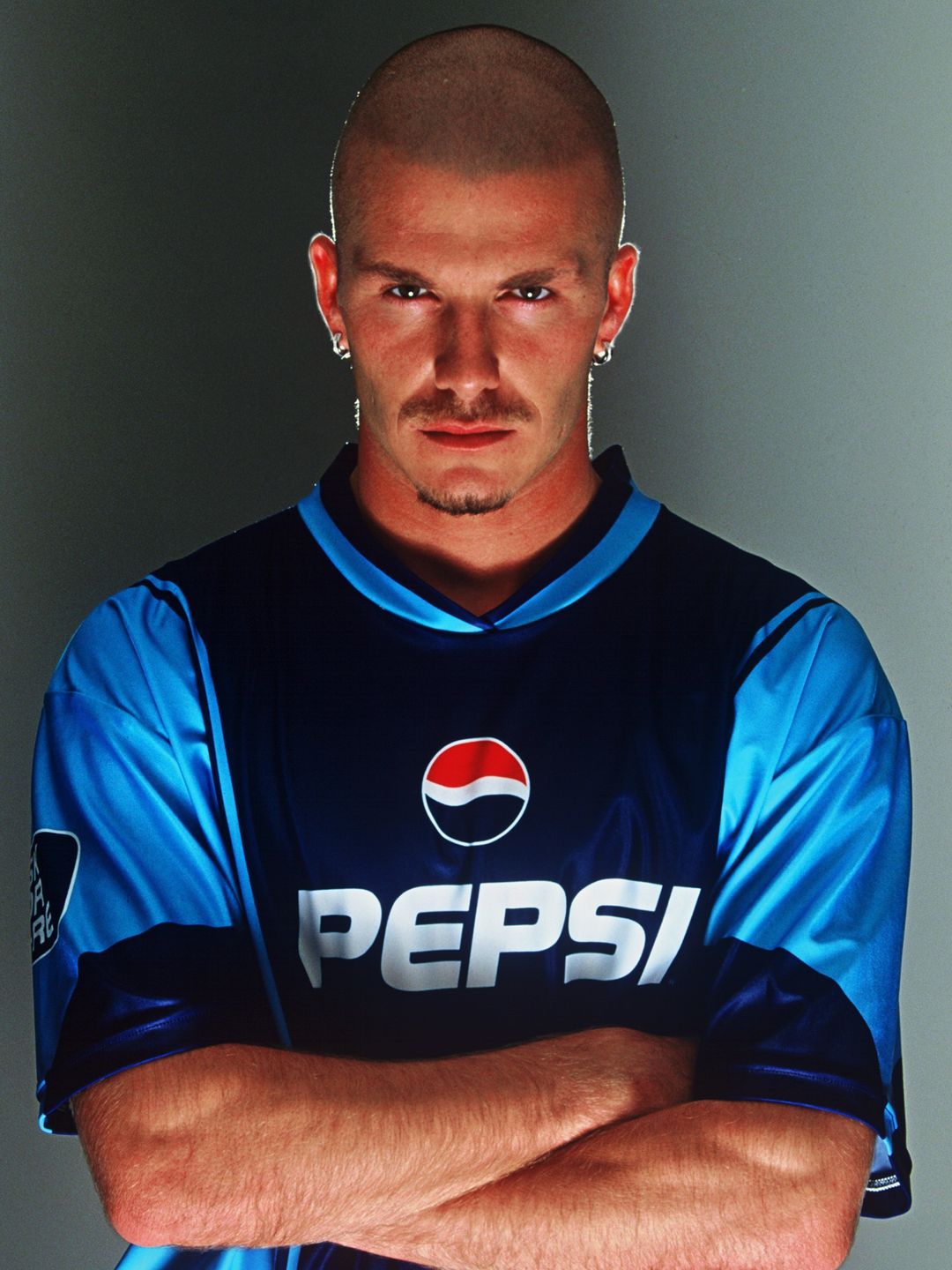 David Beckham of England poses for Pepsi's 'Share The Dream' 2002 advertising campaign in Manchester, England on October 15, 2001