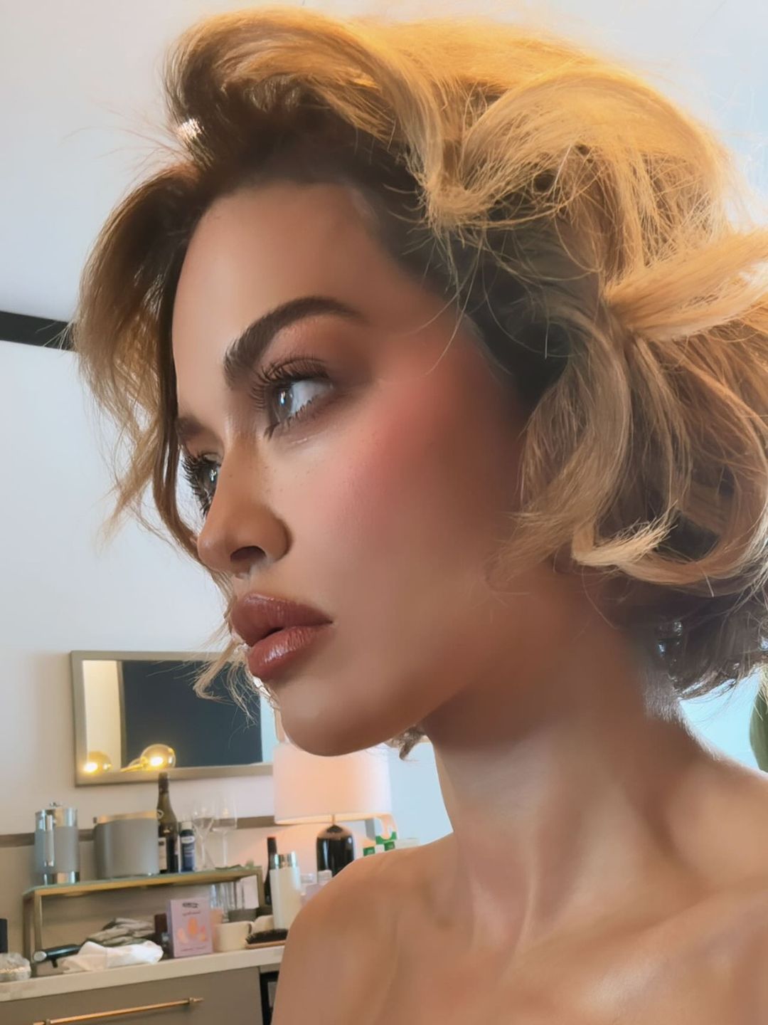 Rita Ora getting ready before the launch of her haircare brand
