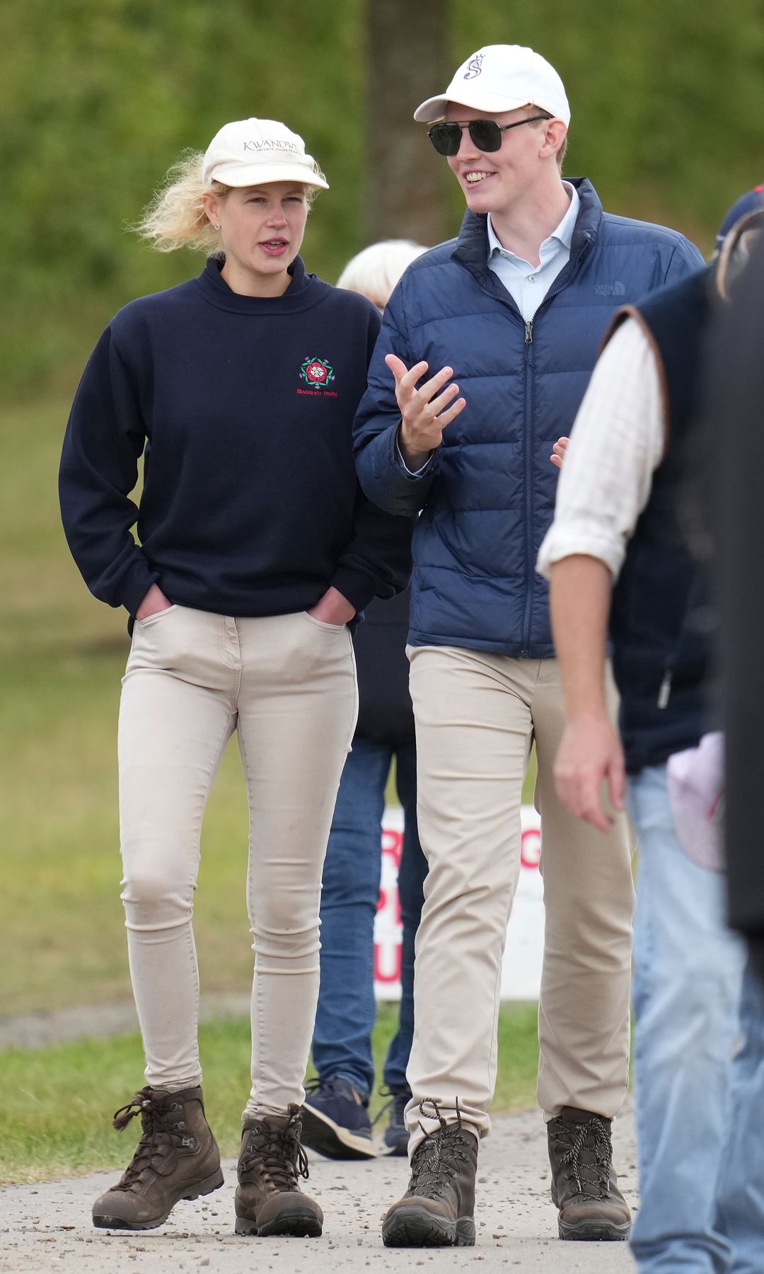 Lady Louise Windsor and Felix da Silva-Clamp talking as they walk together