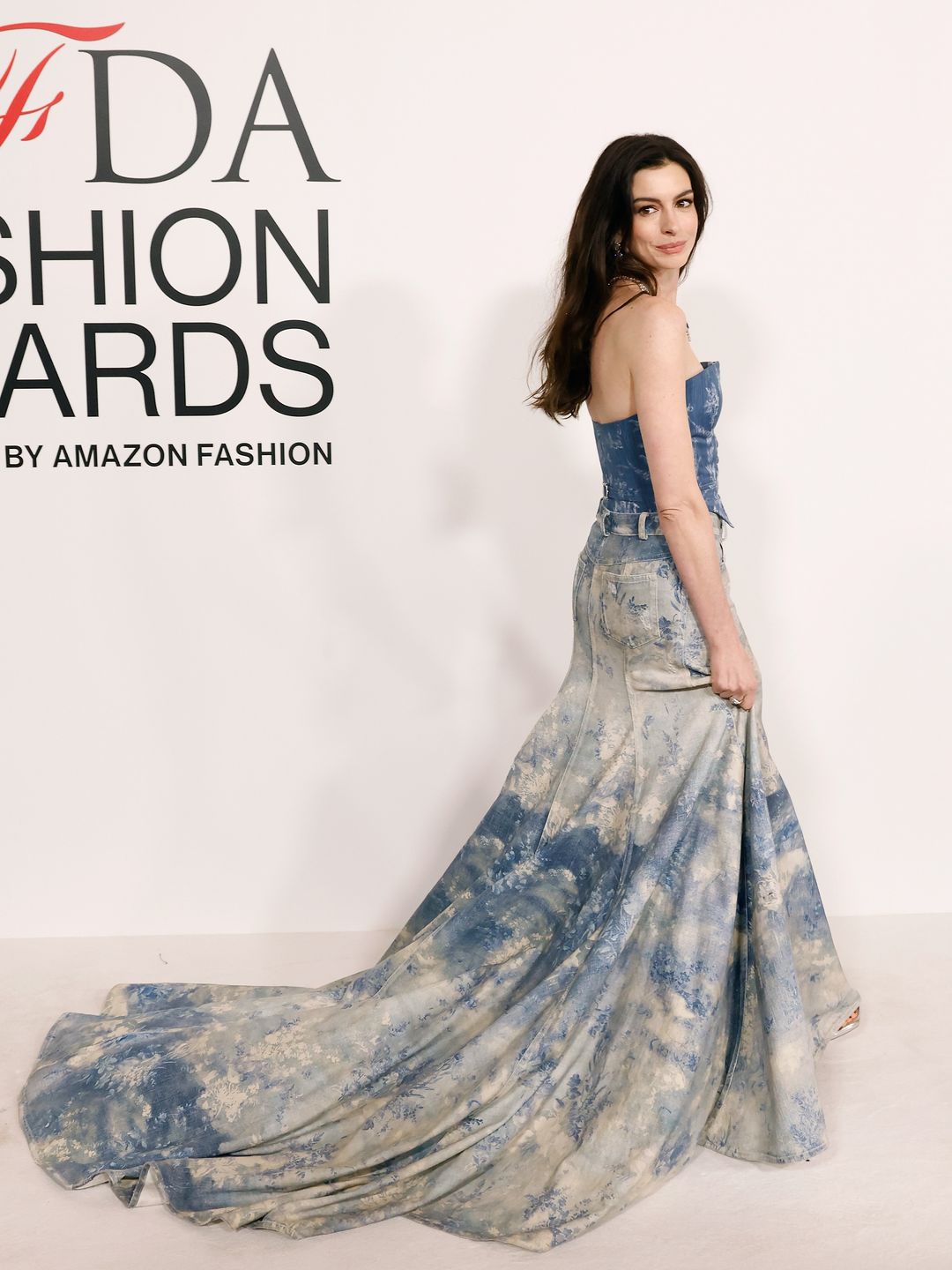 Anne Hathaway wearing double denim corset and maxi skirt 
