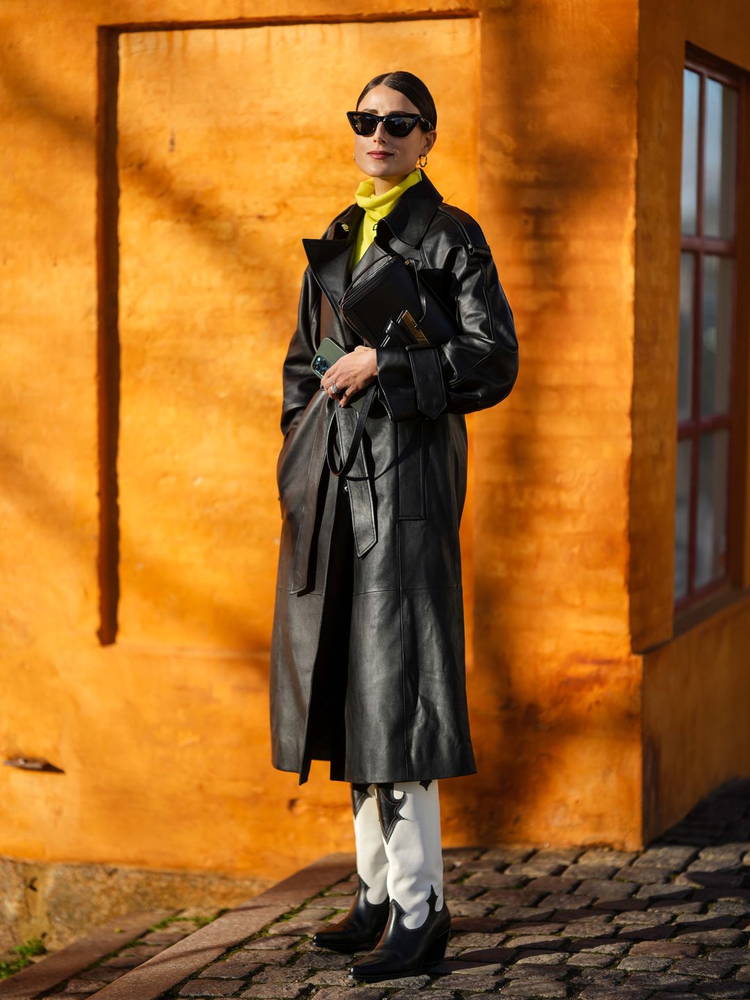 A stylish guest in a yellow turtleneck at Copenhagen Fashion Week AW23 