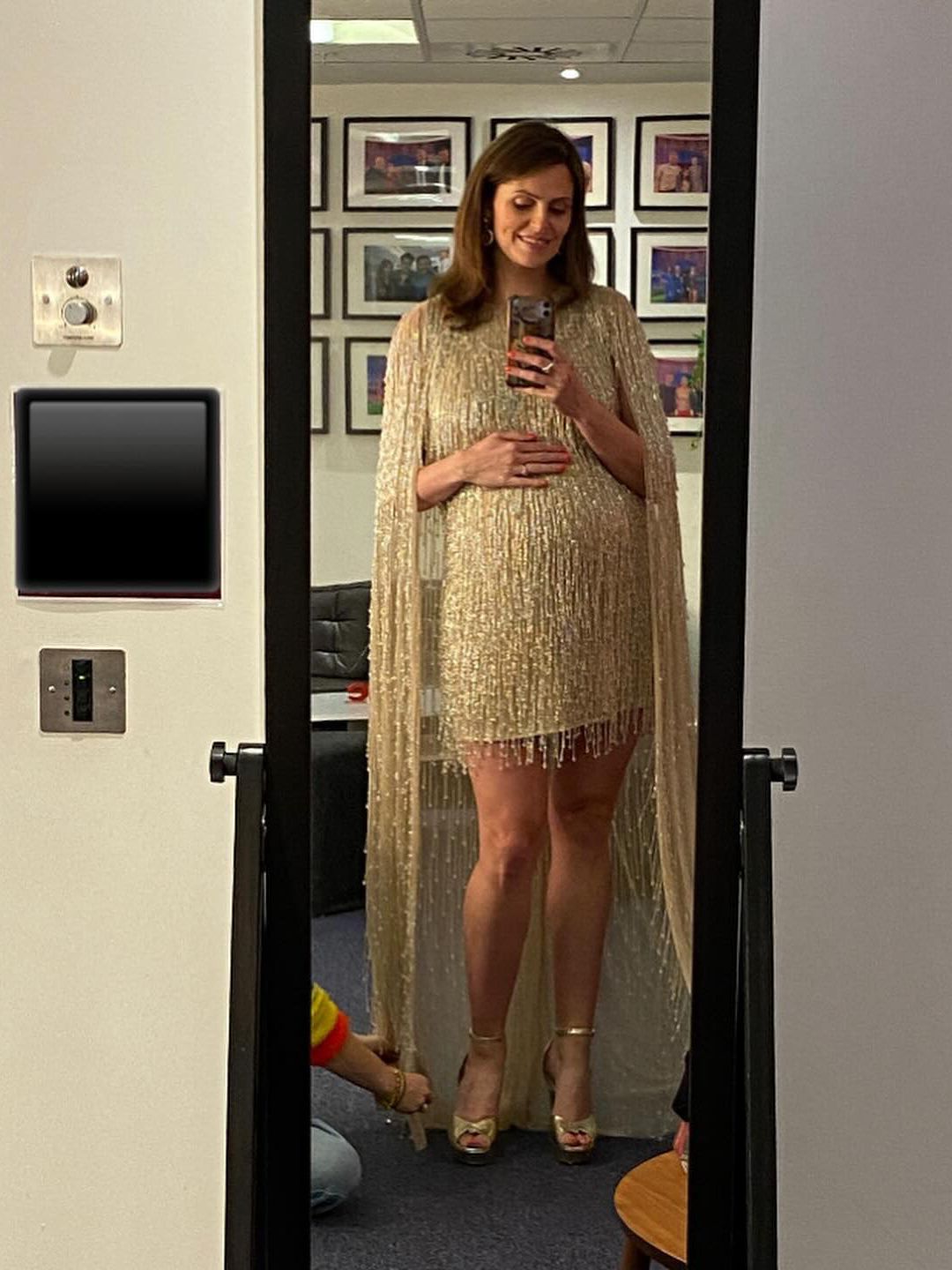 Ellie Taylor in the dress she intended to wear to the Royal Variety Show, prior to her baby's early arrival