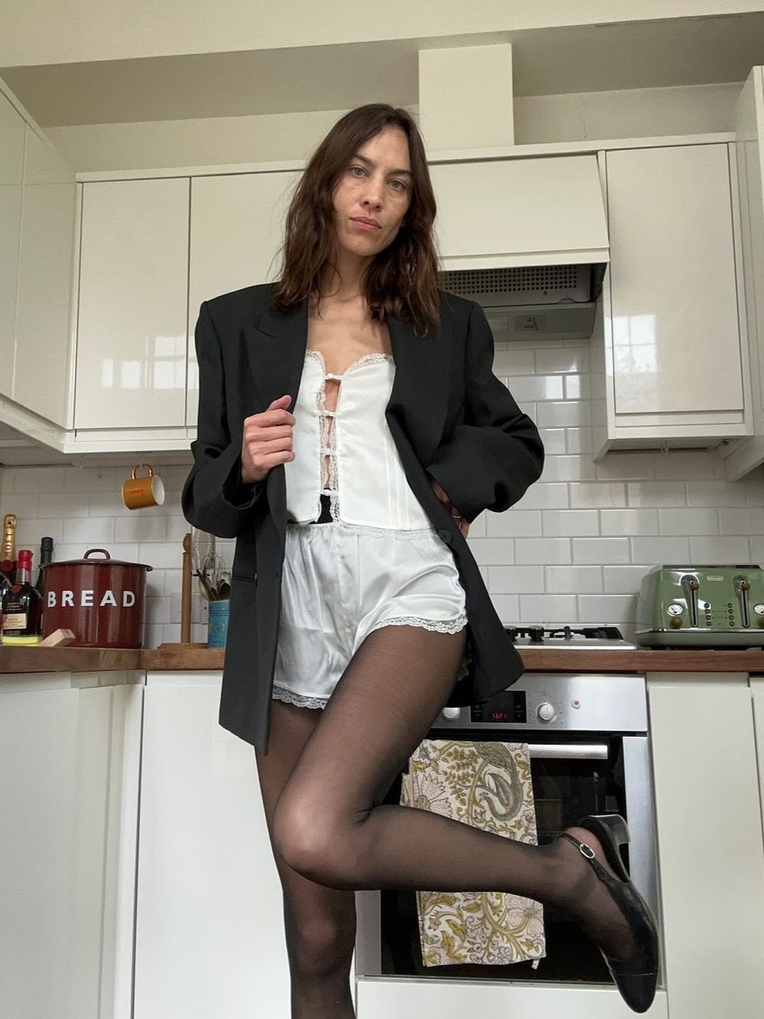 Alexa Chung’s sheer tights and silk pyjama combo is peak It-Girl