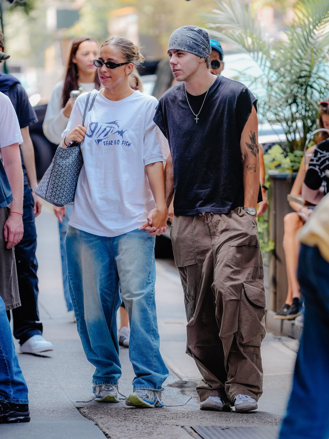 Tate McRae and The Kid LAROI walk hand-in-hand on September 13, 2024 in New York, New York