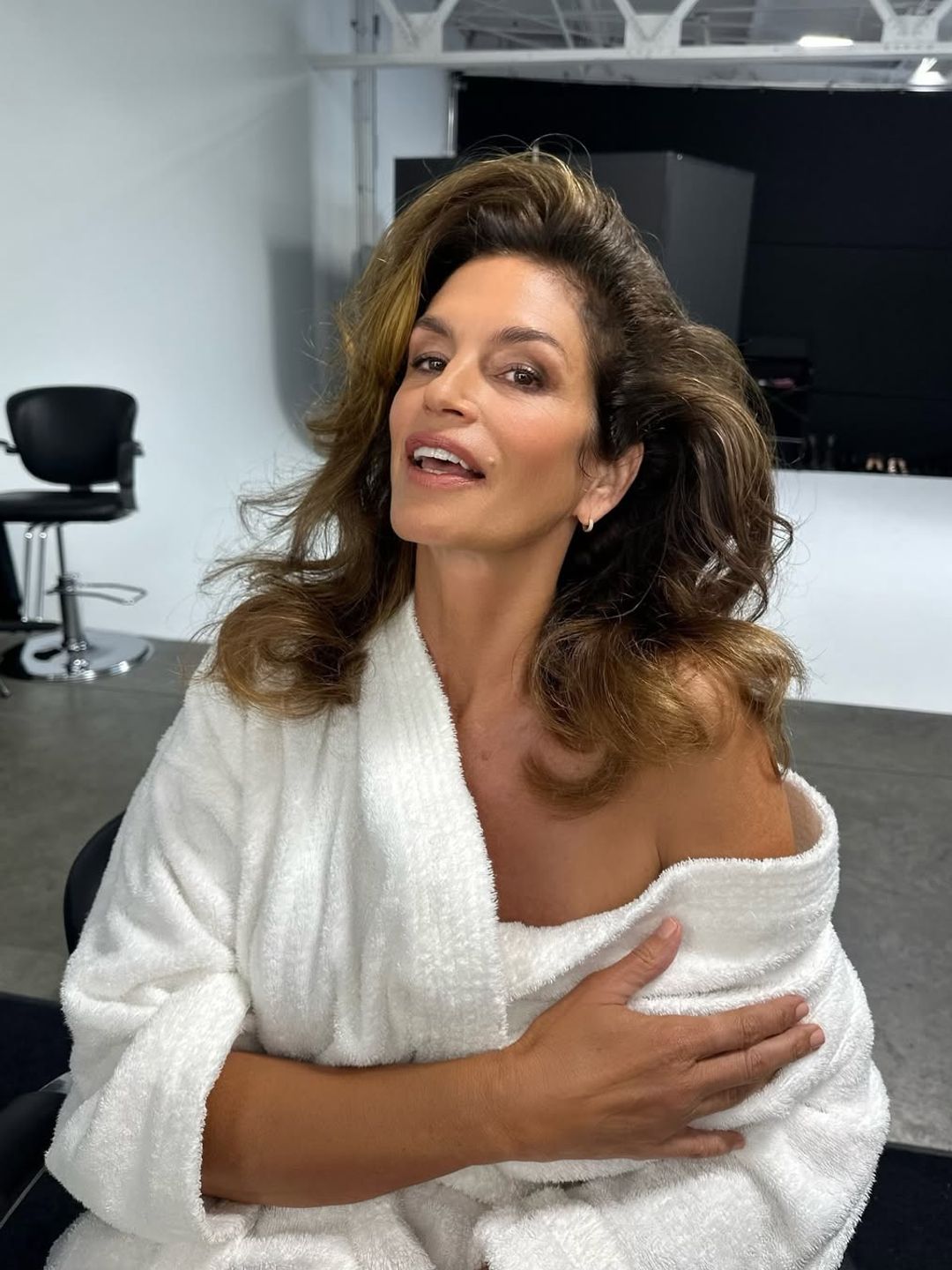 Cindy crawford dolled up in a dressing gown 