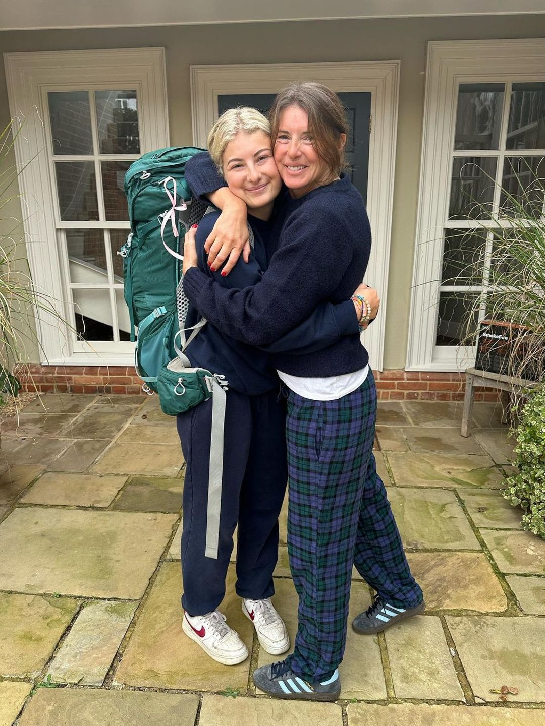 Jools Oliver hugging daughter Poppy tightly as she headed to the airport