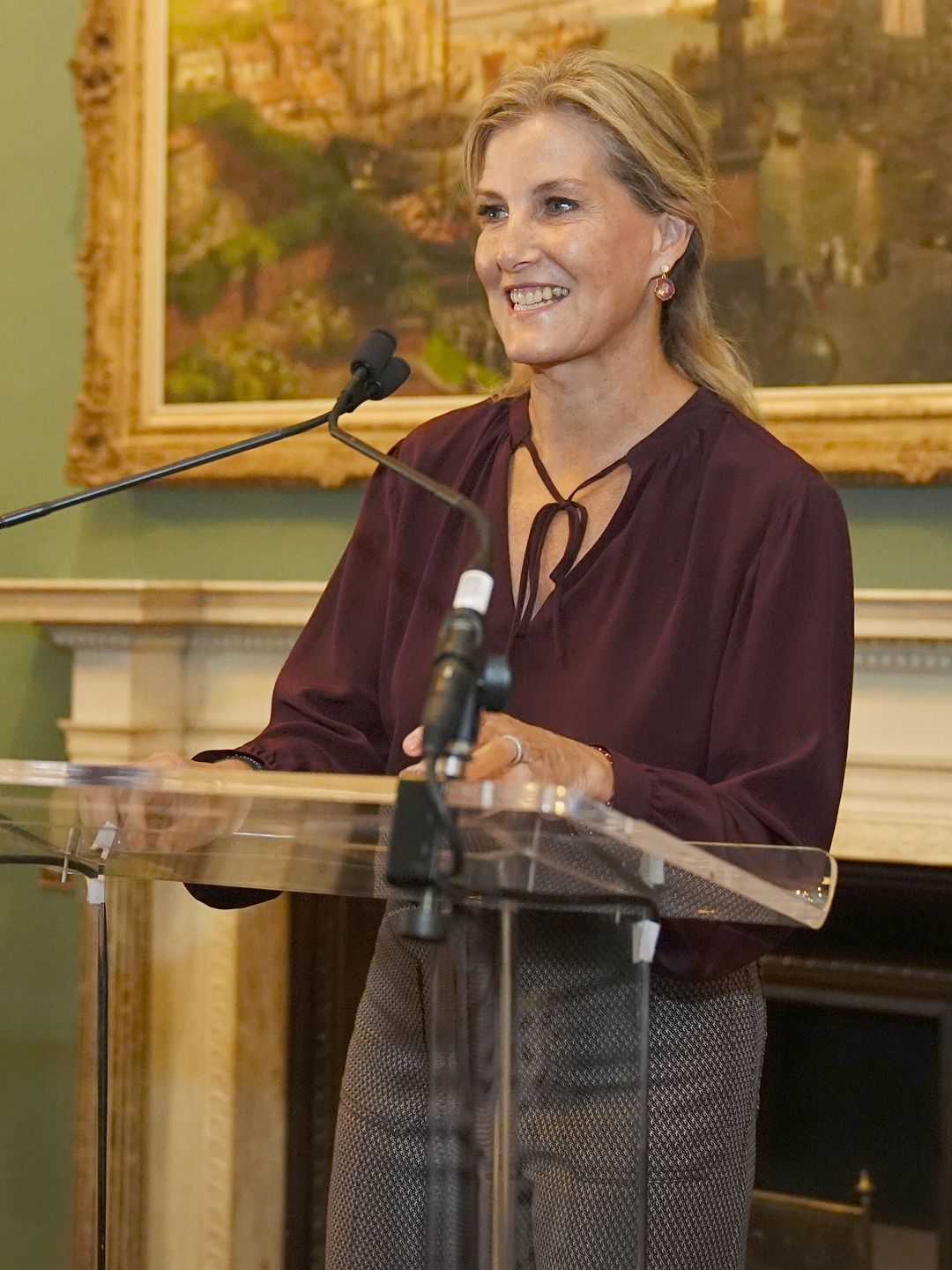 The royal wore a burgundy blouse for the fashionable affair