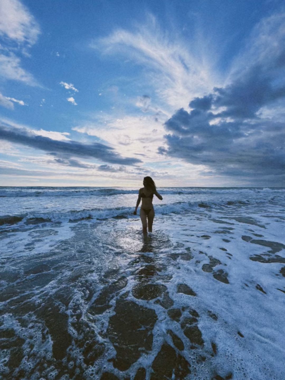 Lily James in a bikini at the beach