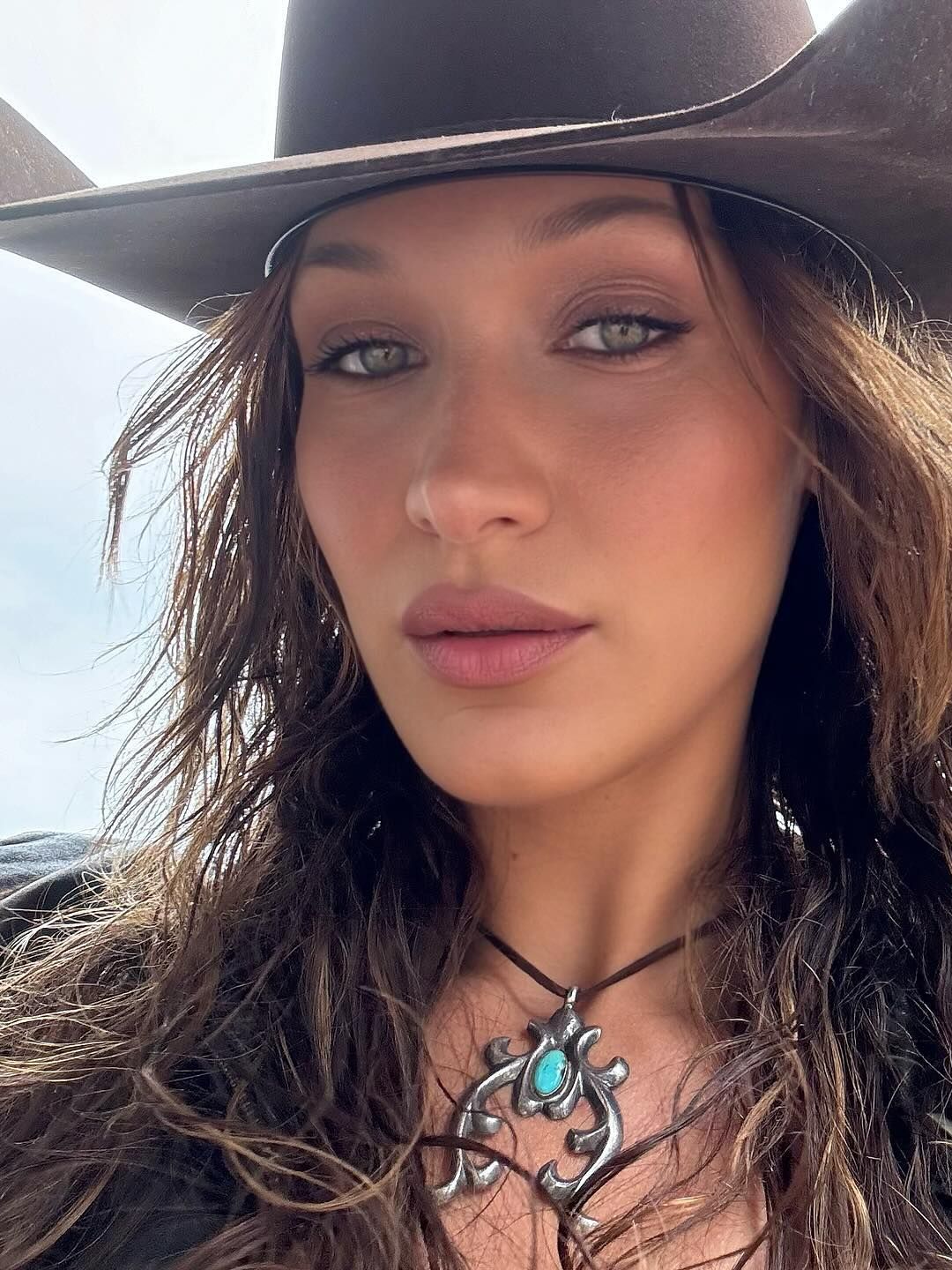 Bella Hadid poses in a cowboy hat on her instagram