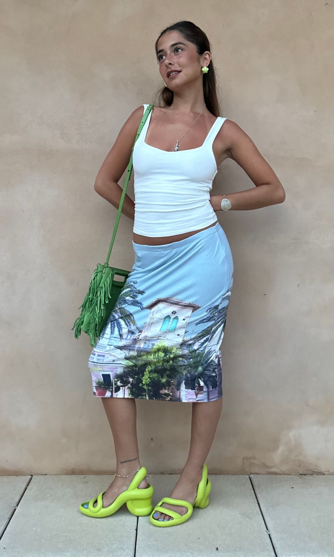 Izadora Hodges in neon yellow shoes and midi skirt