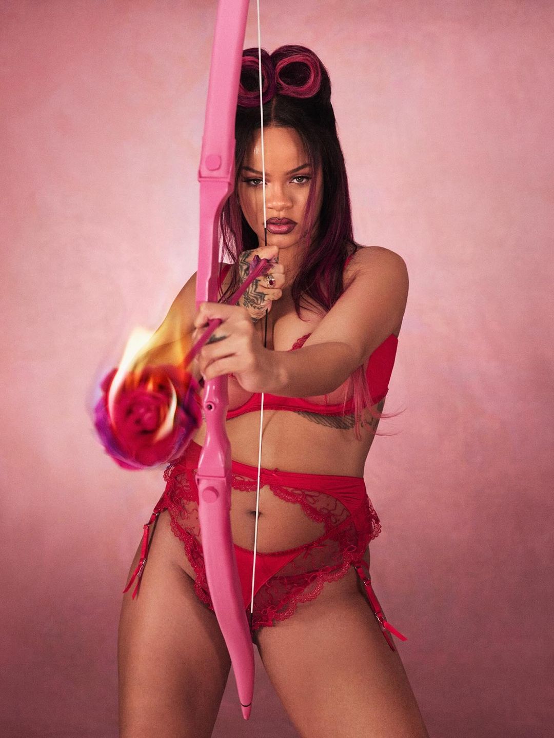 Rihanna poses in a red lingerie set for a new photoshoot