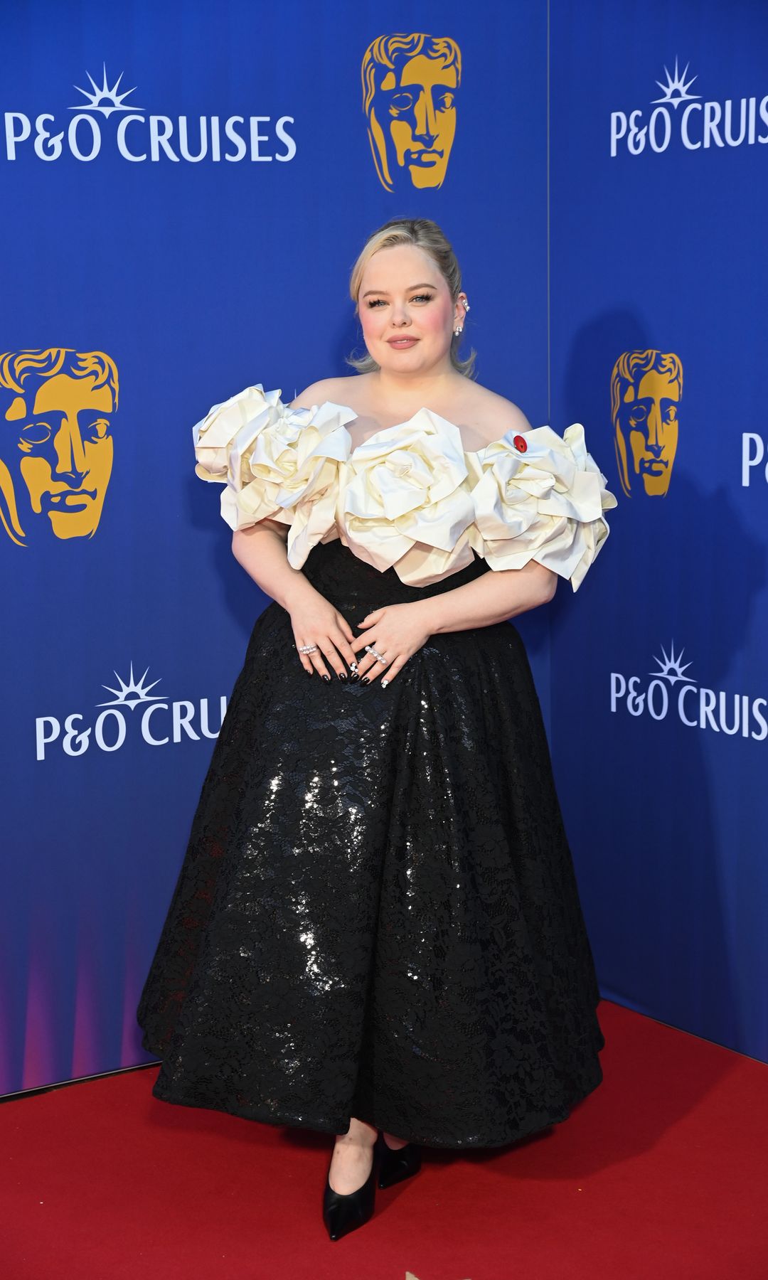 Nicola Coughlan attends the 2025 BAFTA Television Awards With P&O Cruises at The Royal Festival Hall on May 11, 2025 in London, England wearing a black and white dress
