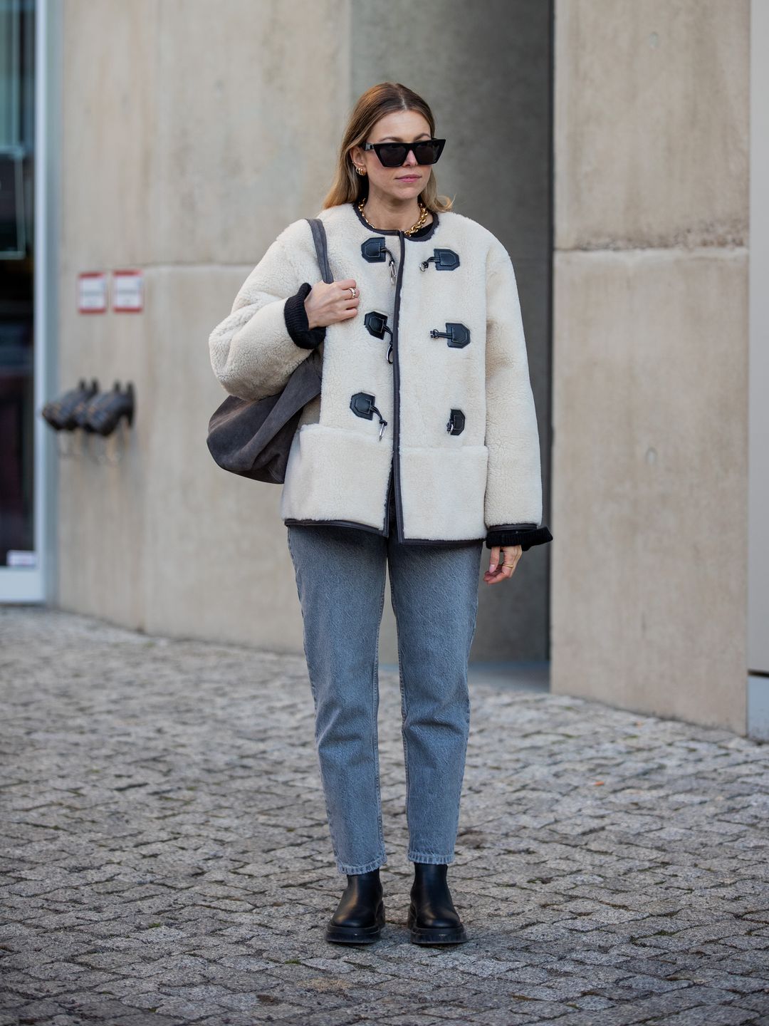 Duffle coat and jeans on model