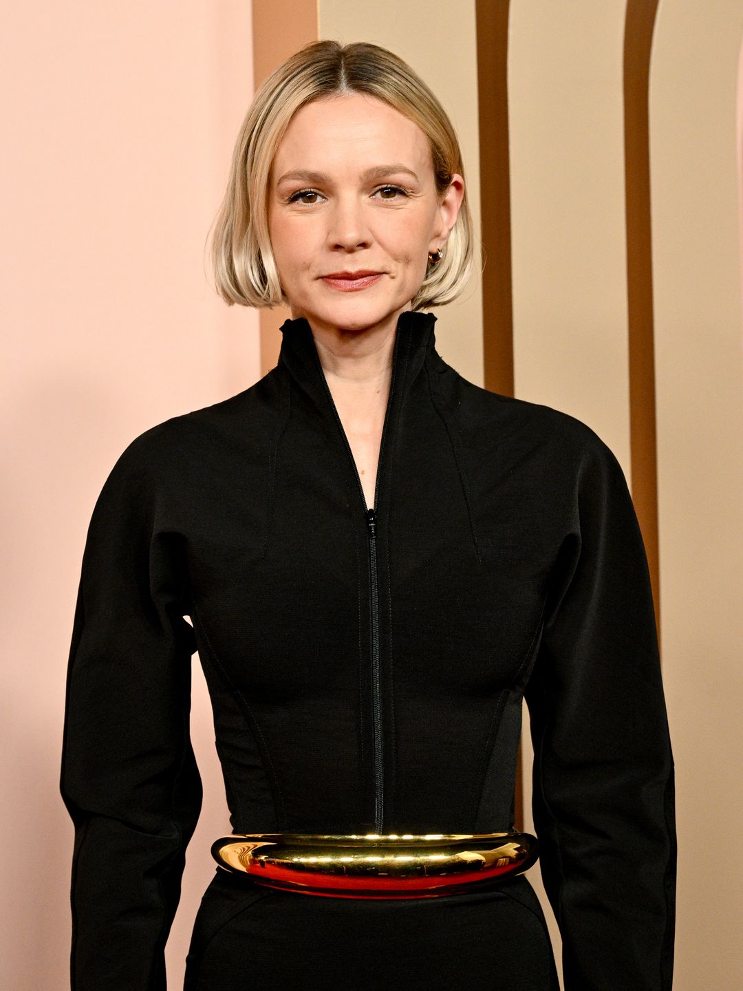 Carey Mulligan wearing a black high-necked dress at the 96th Oscars Nominee Luncheon