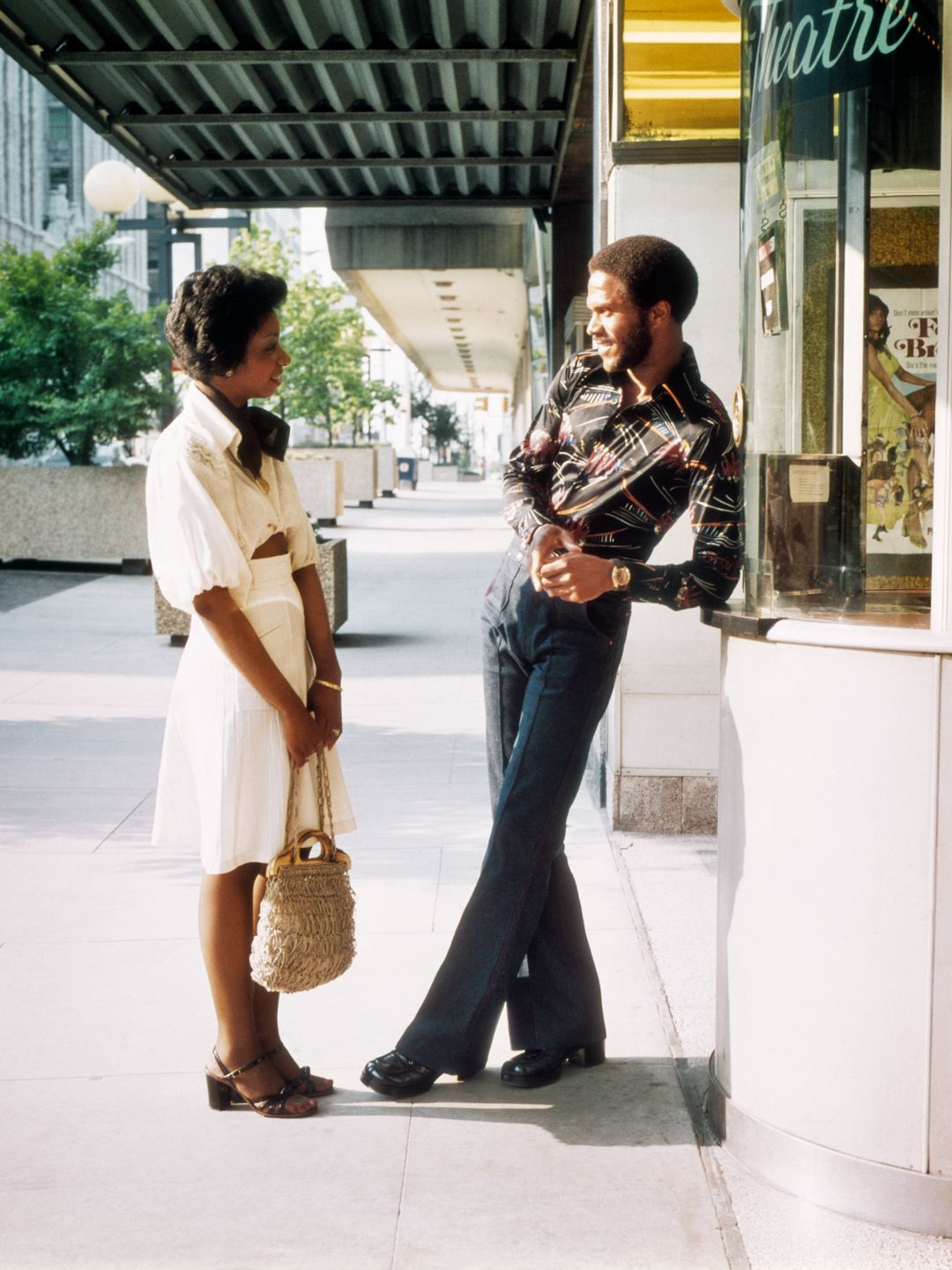1970s Smiling Casually Dressed African-American Couple Man And Woman Meeting Talking At Ticket Window Of Movie Theater   (Photo By H. Armstrong Roberts/Classicstock/Getty Images)