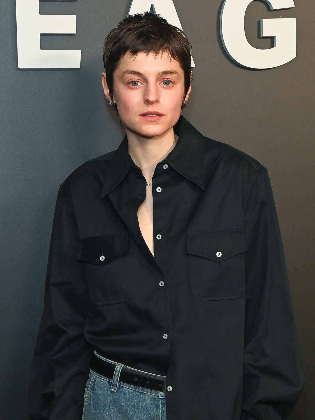Emma Corrin shows us how to style a black shirt and jeans for date