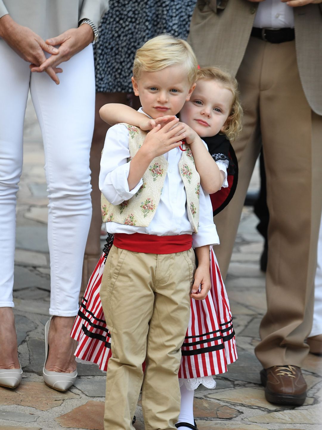 siblings sharing hug at picnic event