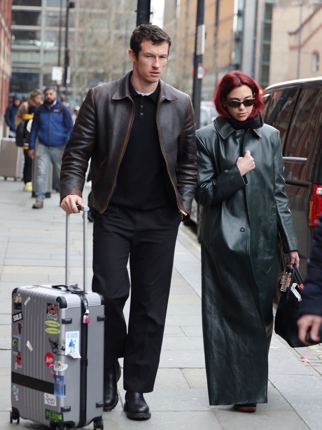 Dua Lipa and Callum Turner arriving at London St Pancras Station after taking the Eurostar from Paris on March 26, 2024 in London, England