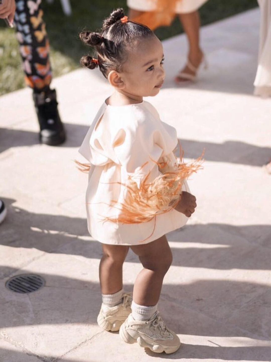 Chicago West walking away from the camera smiling