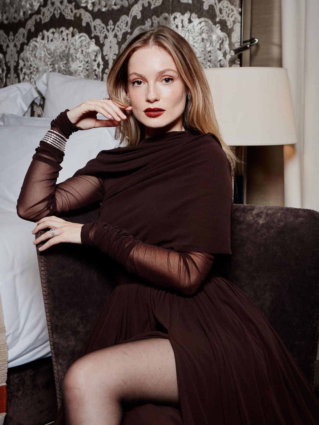 Hannah Dodds poses in a burgundy dress on her Instagram