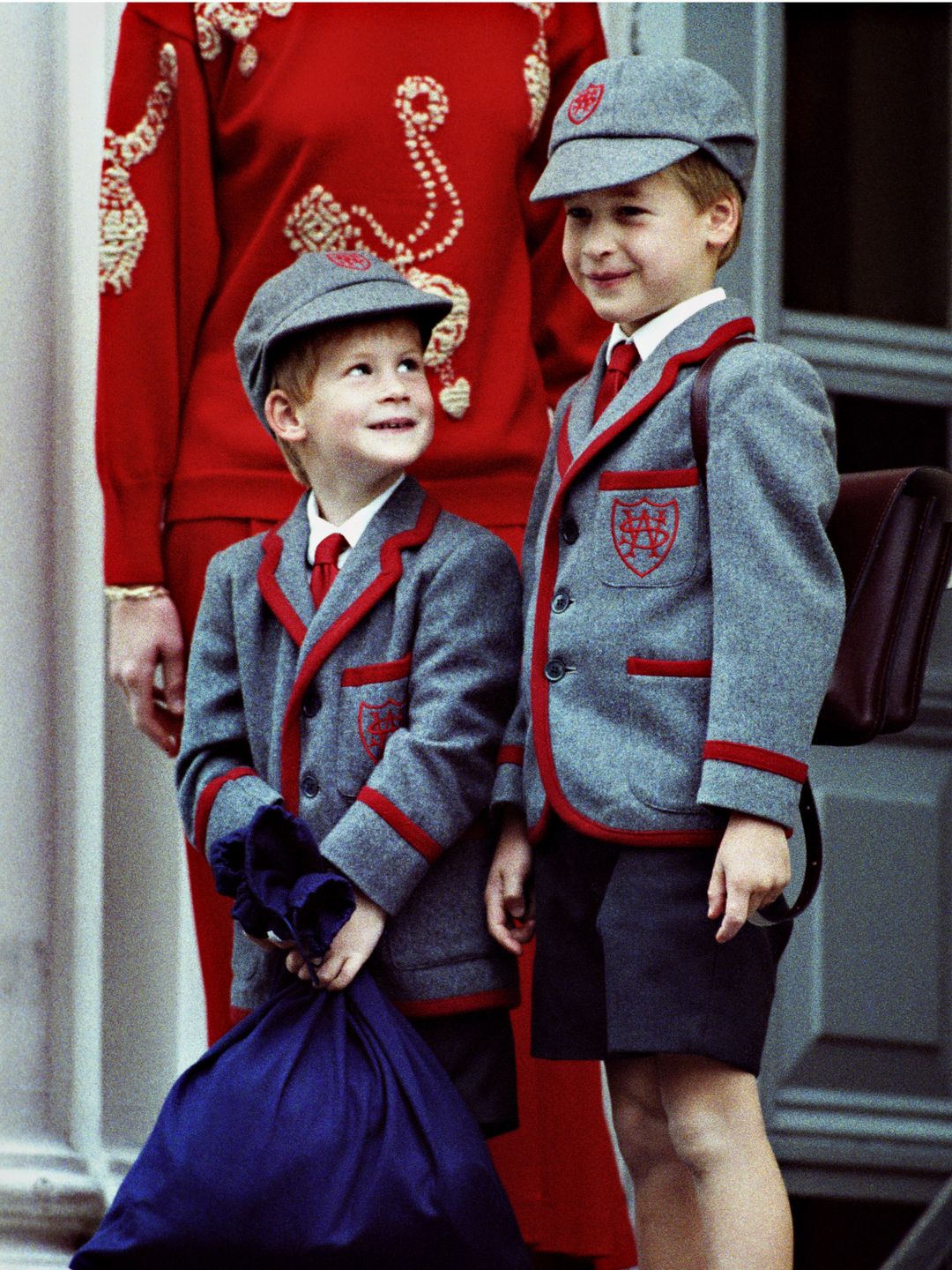 A young Prince Harry and Prince William in school uniform