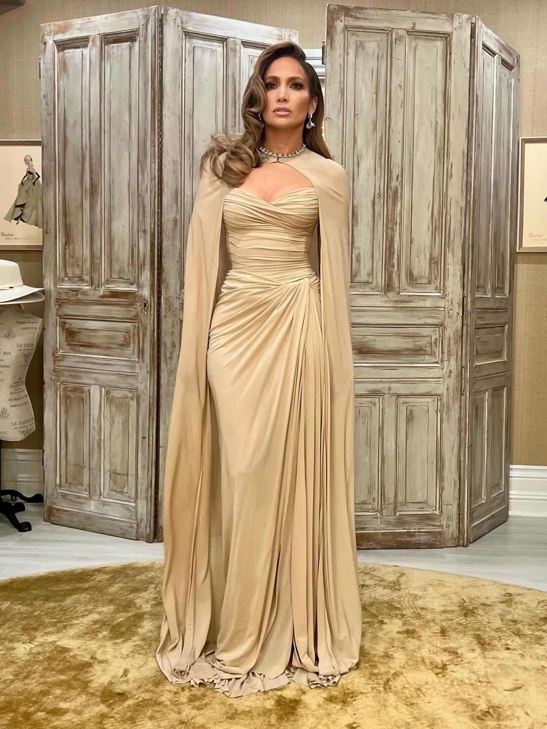 Jennifer Lopez wears a beige gown and cape look on her Instagram