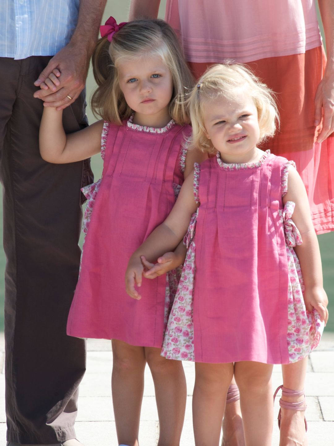 sisters in matching pink dresses 