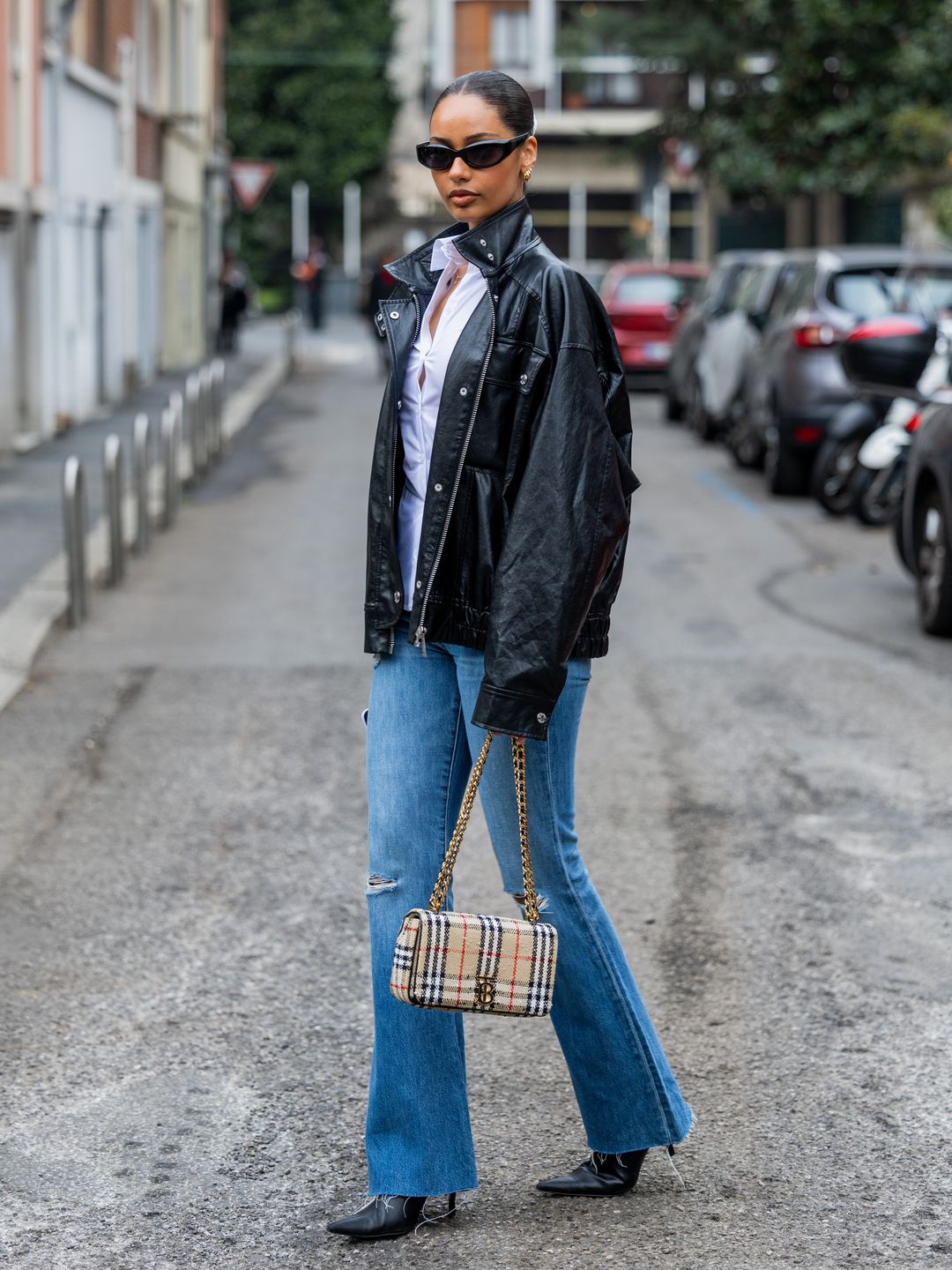 Jamilla Strand totes a Burberry bag during Milan Fashion Week 