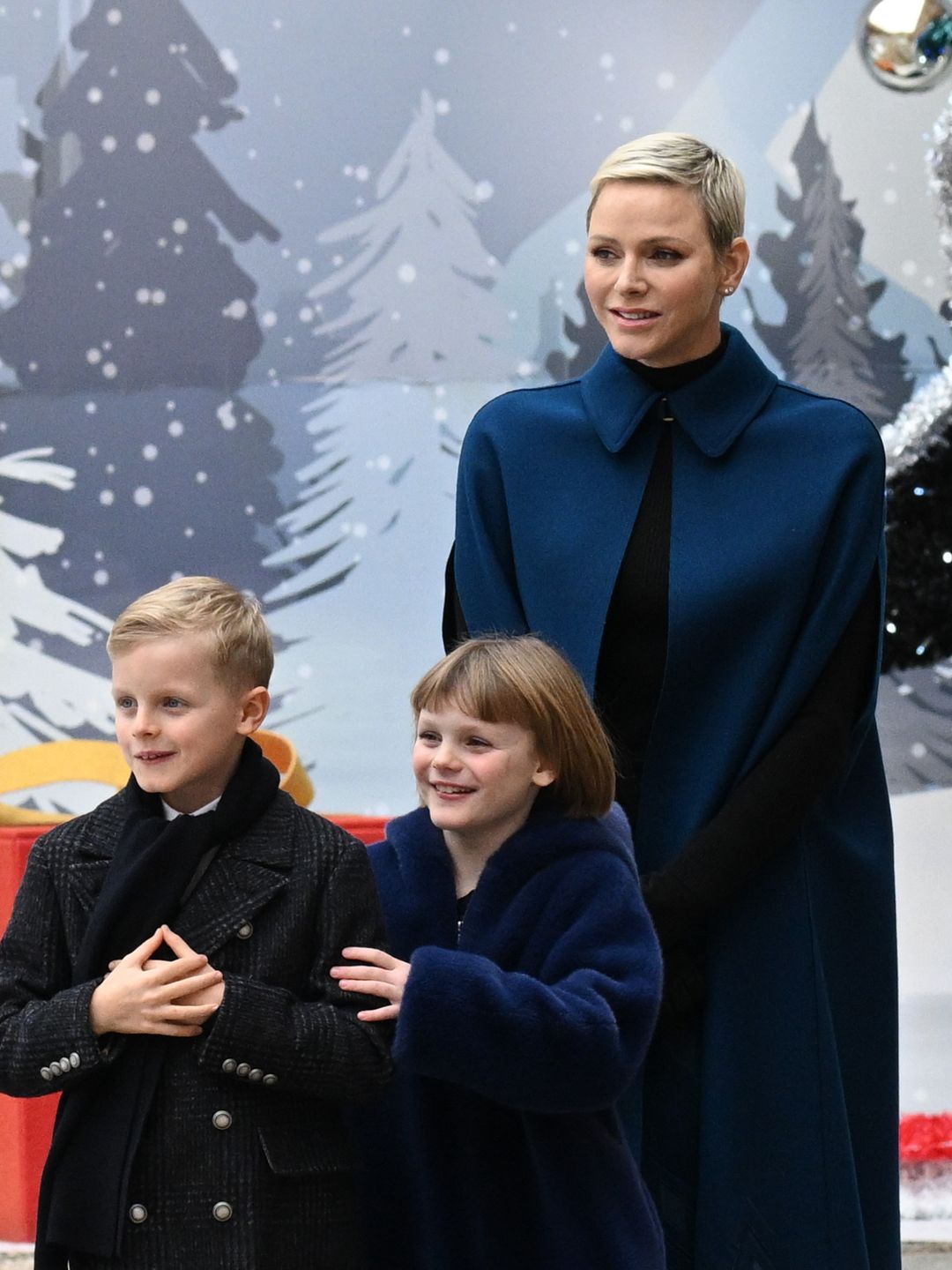 family of four at festive tree ceremony