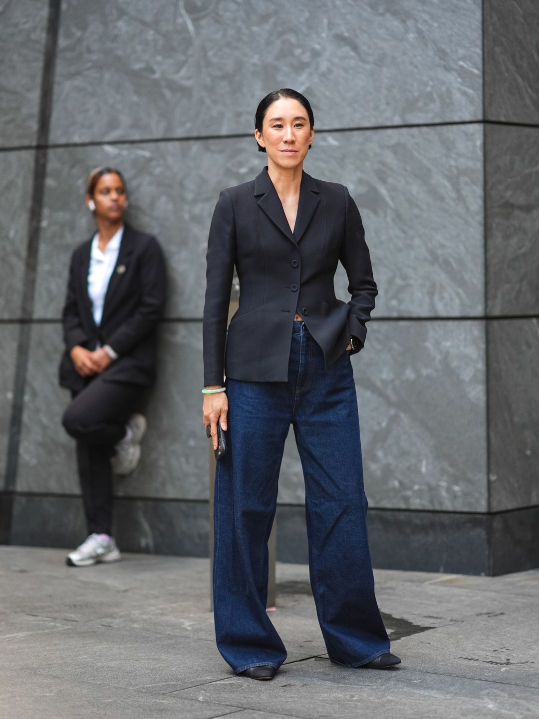 Eva Chen looking cool as a cucumber in dark denim jeans and a well fitting blazer