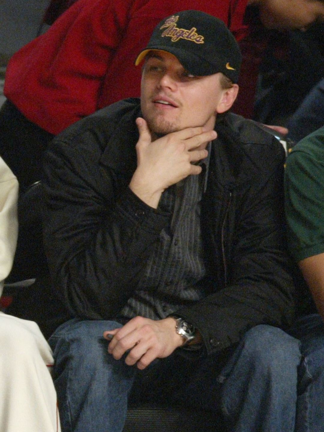 Actor Ashton Kutcher, Kim Porter, music producer Sean "P Diddy" Combs and actor Leonardo DiCaprio attend the 2004 NBA All-Star Game held at the Staples Center, February 15, 2004 in Los Angeles, California.  (Photo by Vince Bucci/Getty Images)