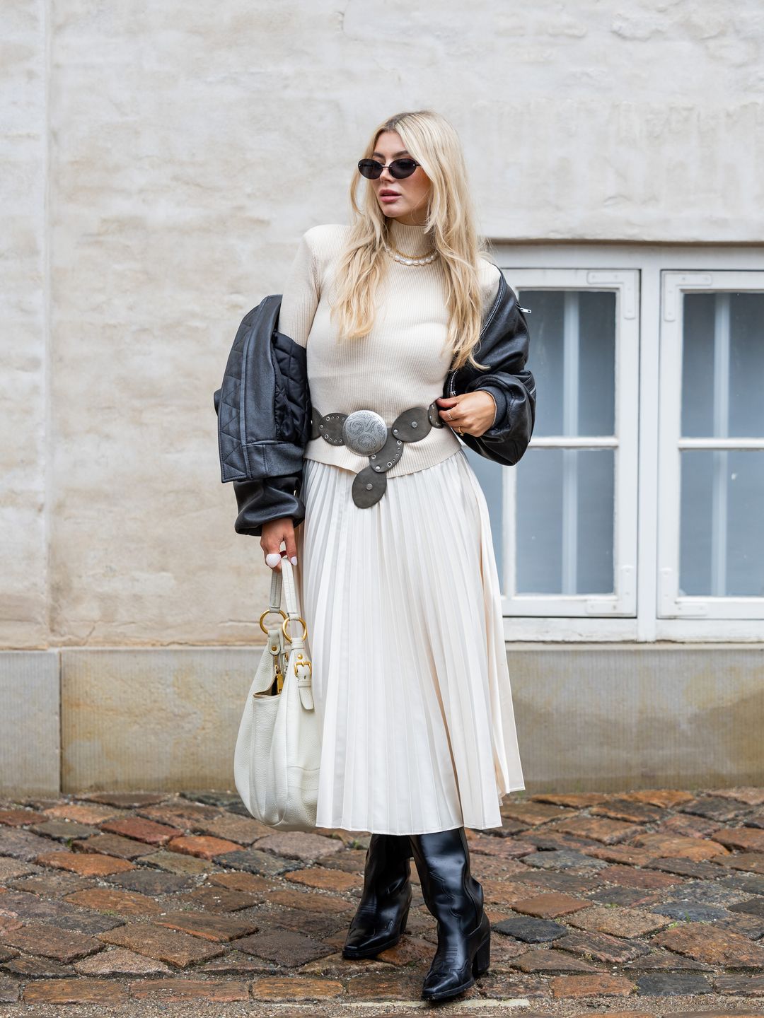 Teresa Jg wearing a cream turtleneck at Copenhagen Fashion Week SS24 