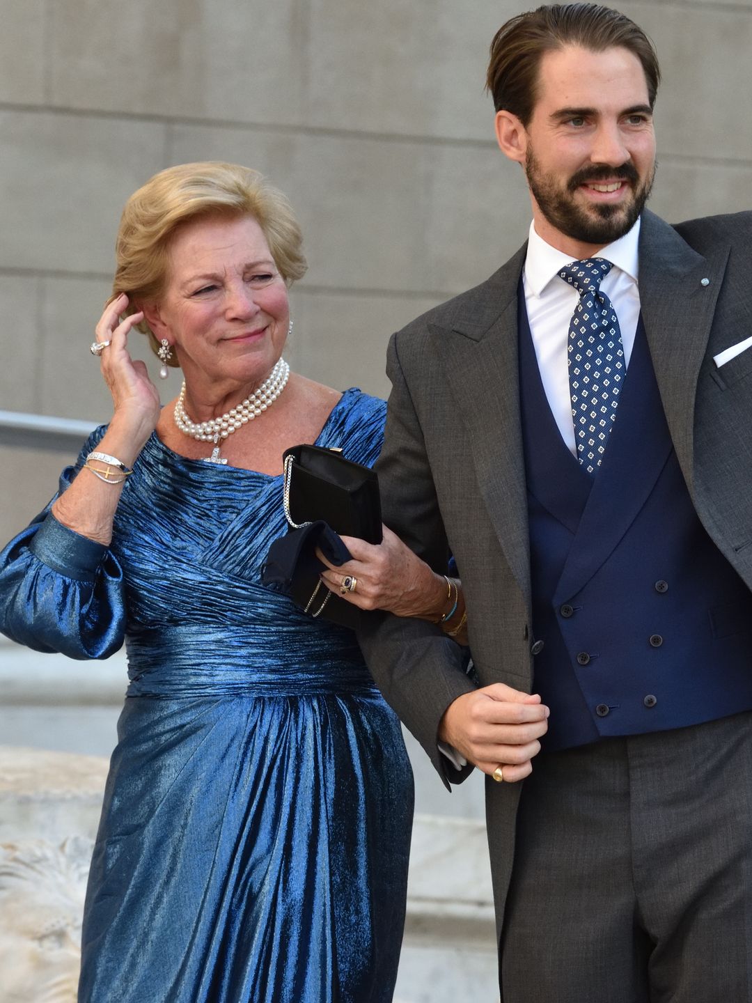 Queen Anne-Marie in a blue dress next to Prince Philippos