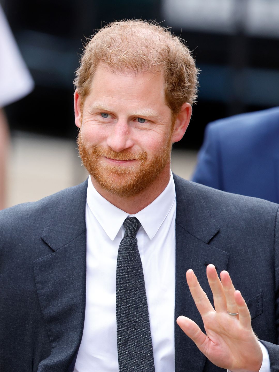 Prince Harry smiling and waving