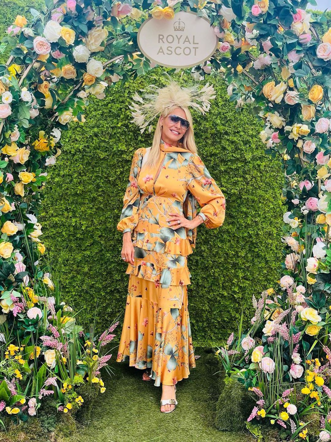 Tess Daly wearing a gold floral dress at Royal Ascot