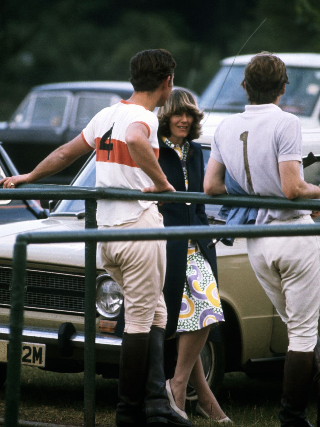 A young Charles and Camilla at a polo match
