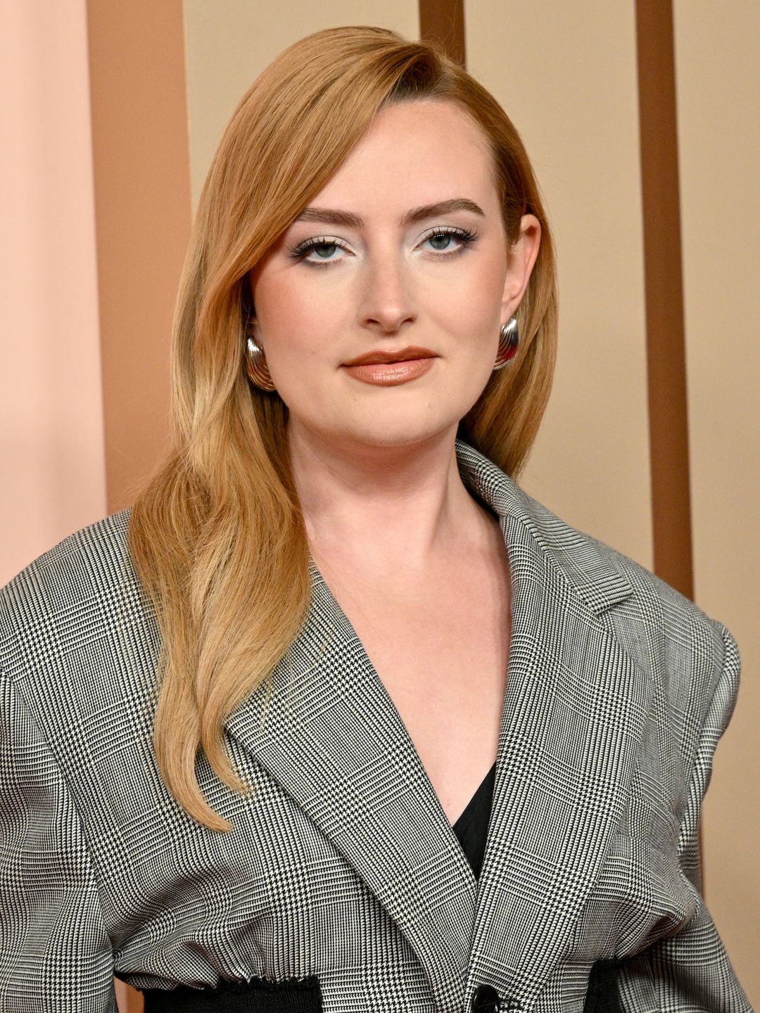 Amelia Dimoldenberg in a grey suit at the Oscars Luncheon