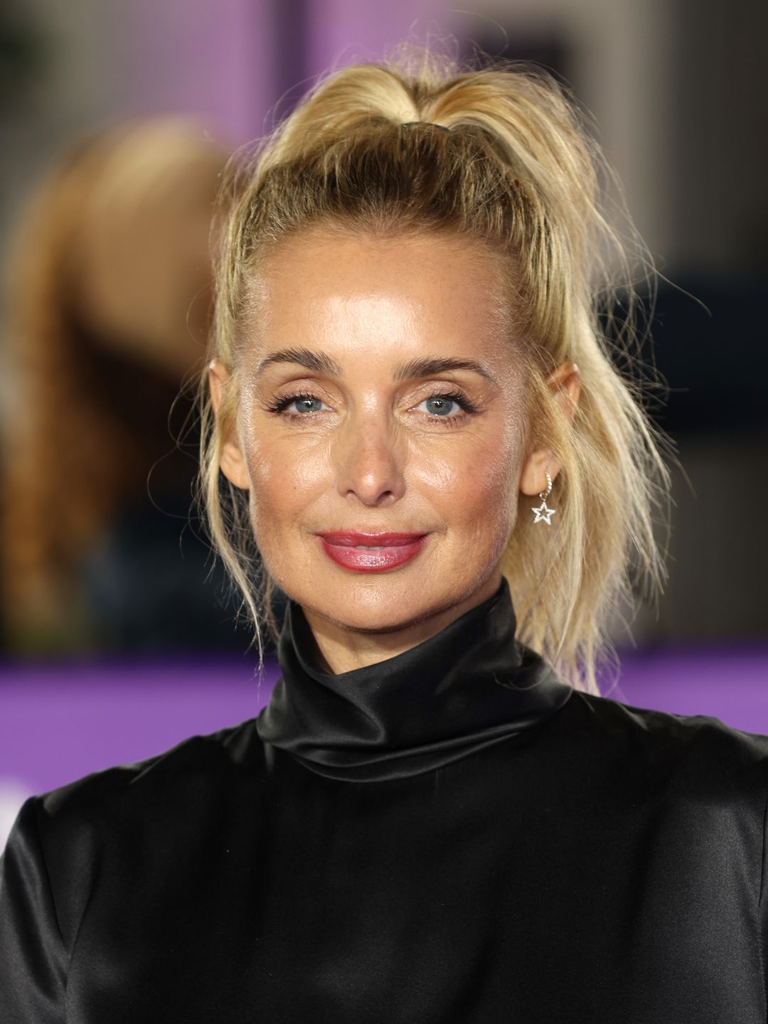 A portrait of Louise Redknapp with a glowy base and raspberry pink lip at the Pride of Britain Awards 