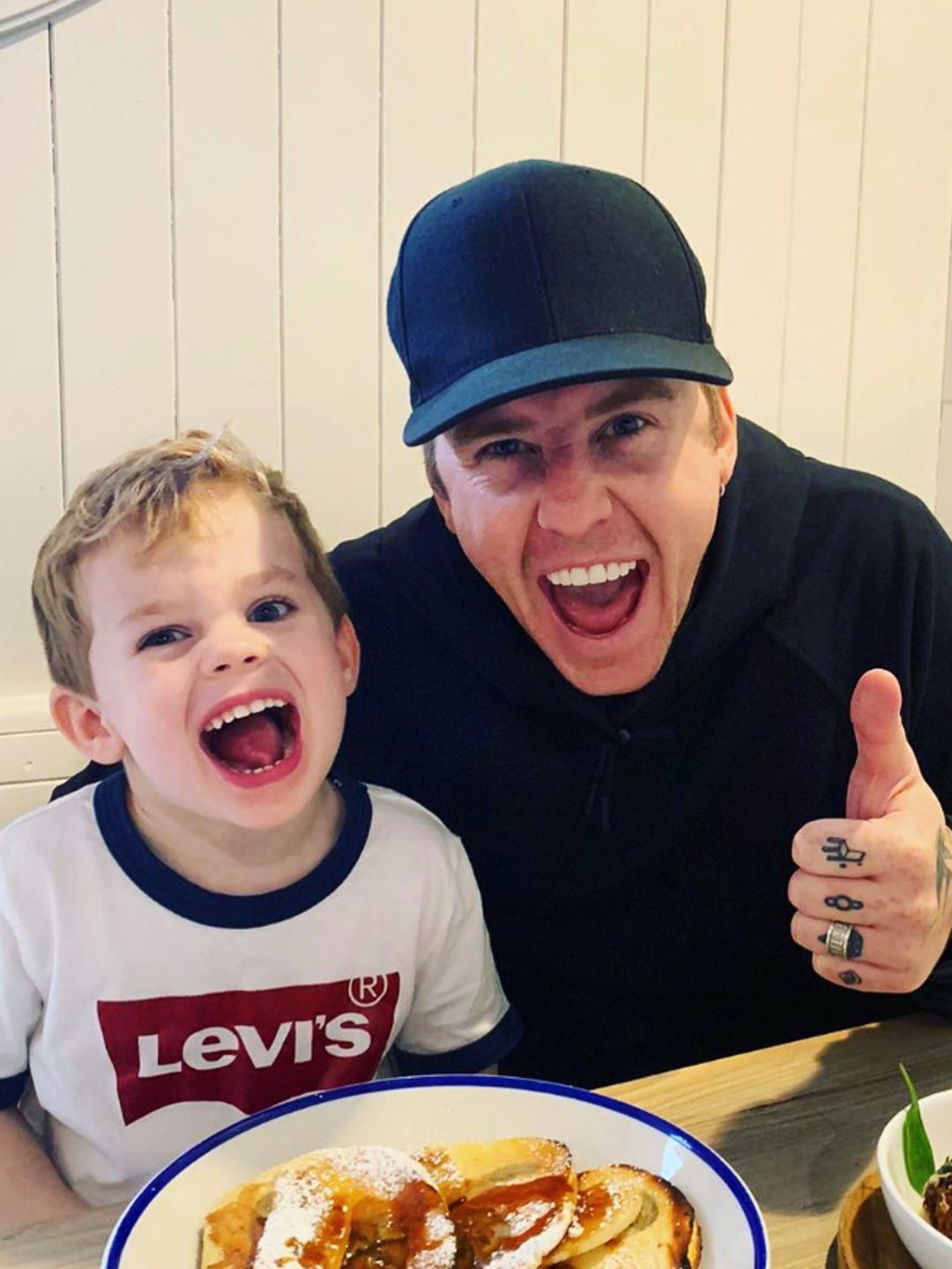 Danny Jones and his son sitting at a table