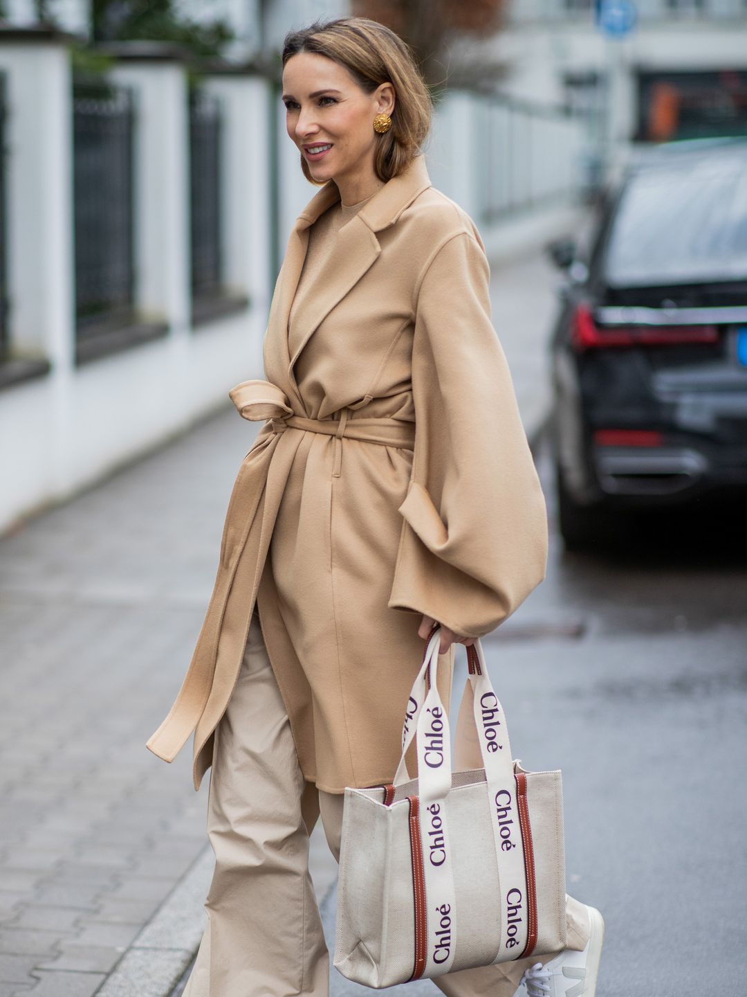 woman holding chloe bag street style 